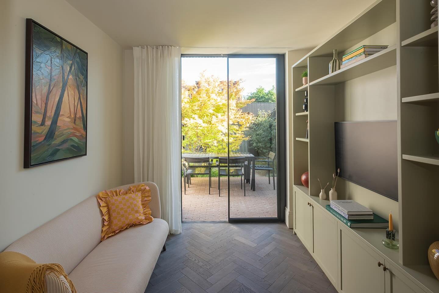 I designed the open plan downstairs space in my Leyton project so the kitchen, dining and living areas all work together in a calm, cohesive way.

When you&rsquo;re in the kitchen and look through, you catch the sofa and the garden beyond. Nothing fe