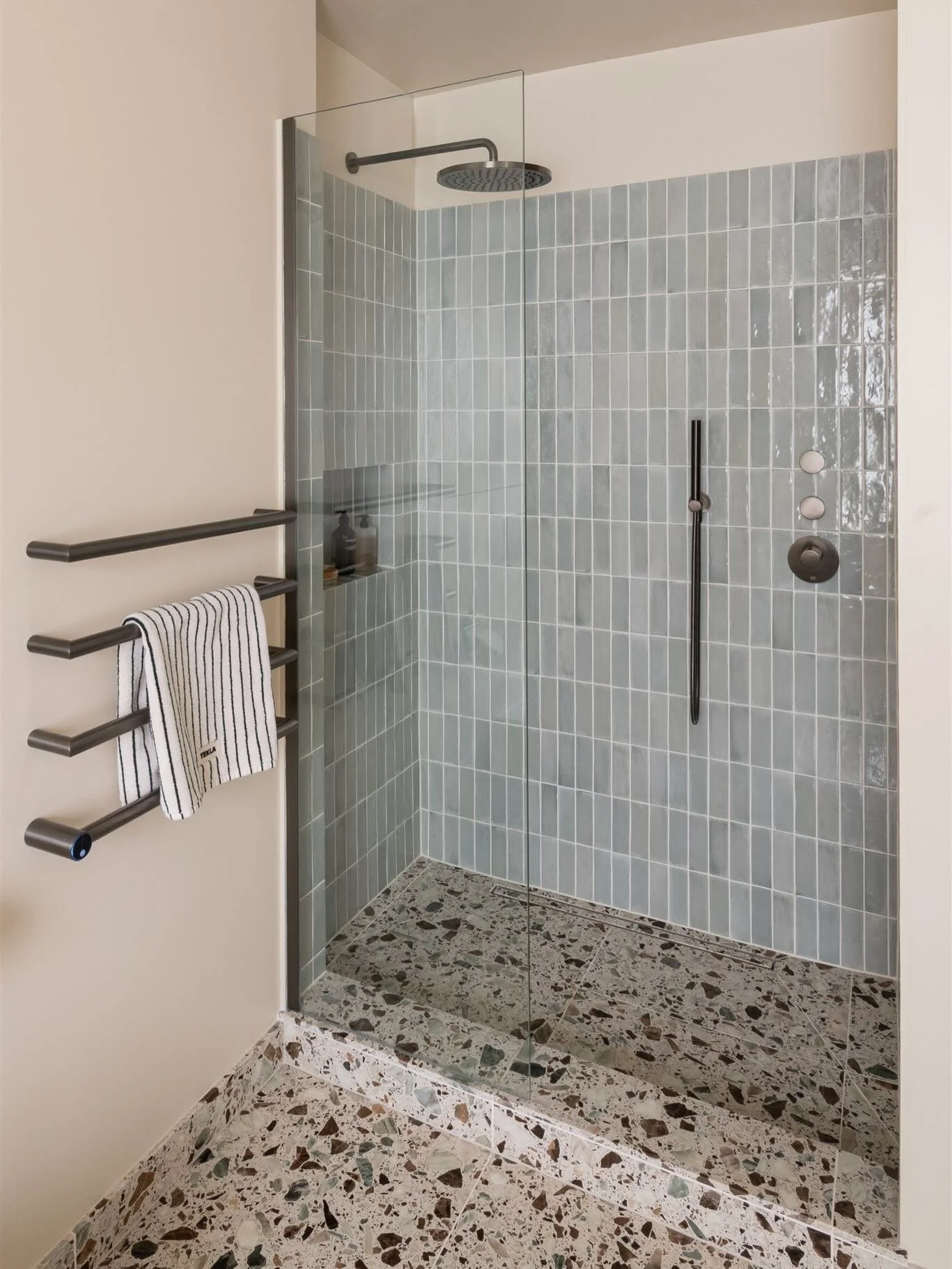 I wanted this shower area to feel a little like a luxury hotel spa. Calm, soft and somewhere you&rsquo;d really want to slow down in 🩵.

The handmade tiles were a big part of that. Each one has slight variations in tone, with soft blue shades that p