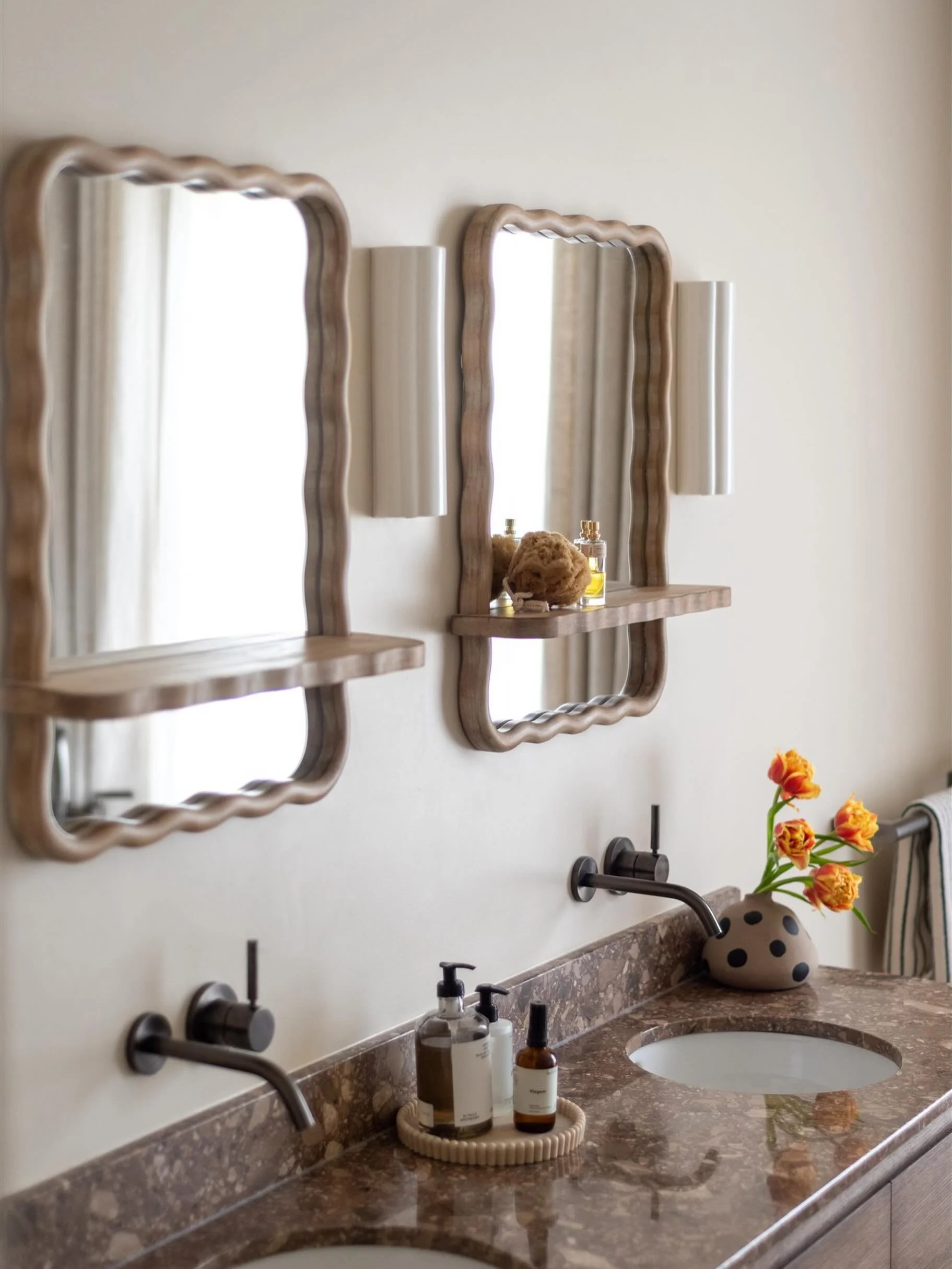 Not everything in a room has to be a huge investment to make a BIG impact. These wiggle mirrors were actually a more affordable find from @nexthome, and I think they work so beautifully in this bathroom because they bring in a softer, more playful sh