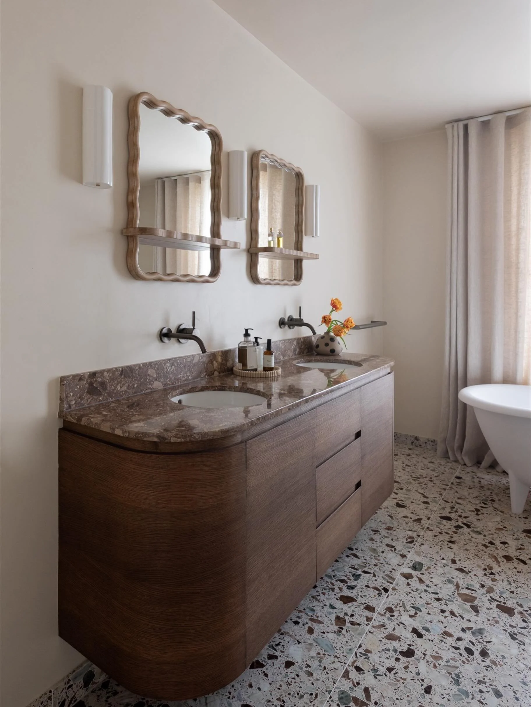 One of the most practical decisions in this bathroom was using wall-mounted taps above the vanity. This meant the terrazzo worktop didn&rsquo;t need to be as deep, which helps the room feel more spacious while also creating more storage inside the va