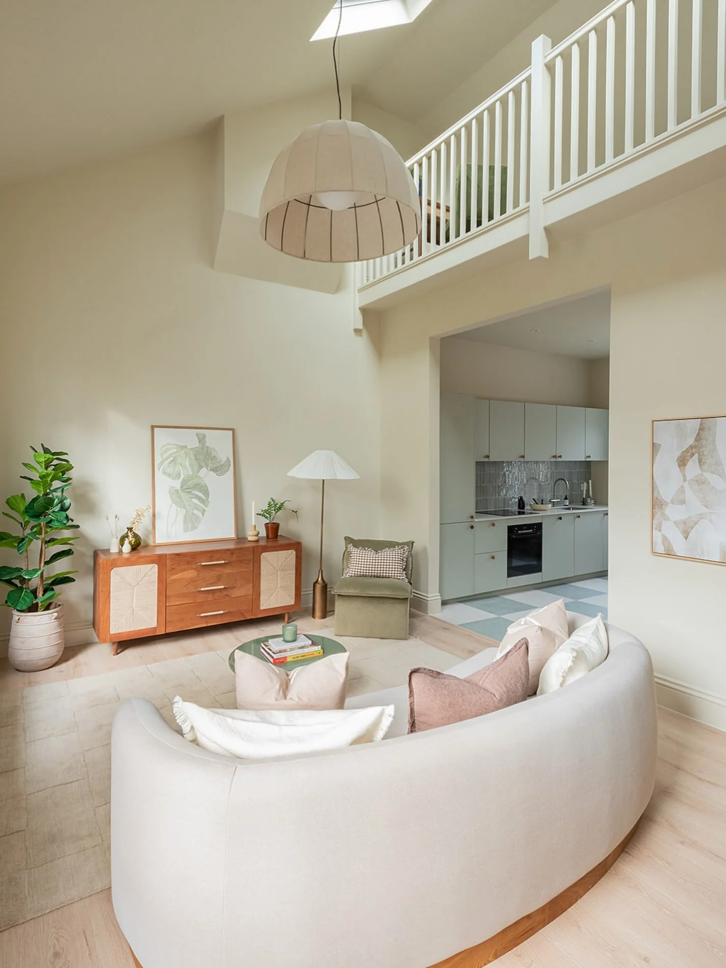 Colour drenching isn&rsquo;t just about creating a cosy atmosphere. It can completely change how a room feels.

In this project, the dramatic double-height ceiling and mezzanine create lots of architectural lines. By using the same soft shade across 