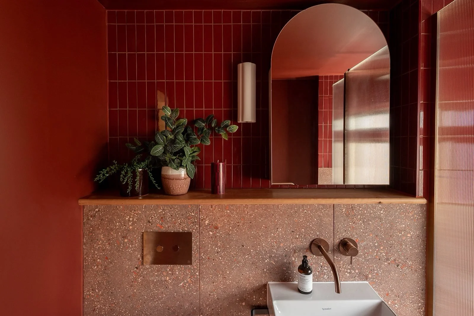 A bathroom doesn&rsquo;t need to be light and bright to feel inviting. If you have a room with limited natural light, my advice is often not to fight it. Leaning into deeper, warmer tones can completely change the mood of the space.

Here, we used ri