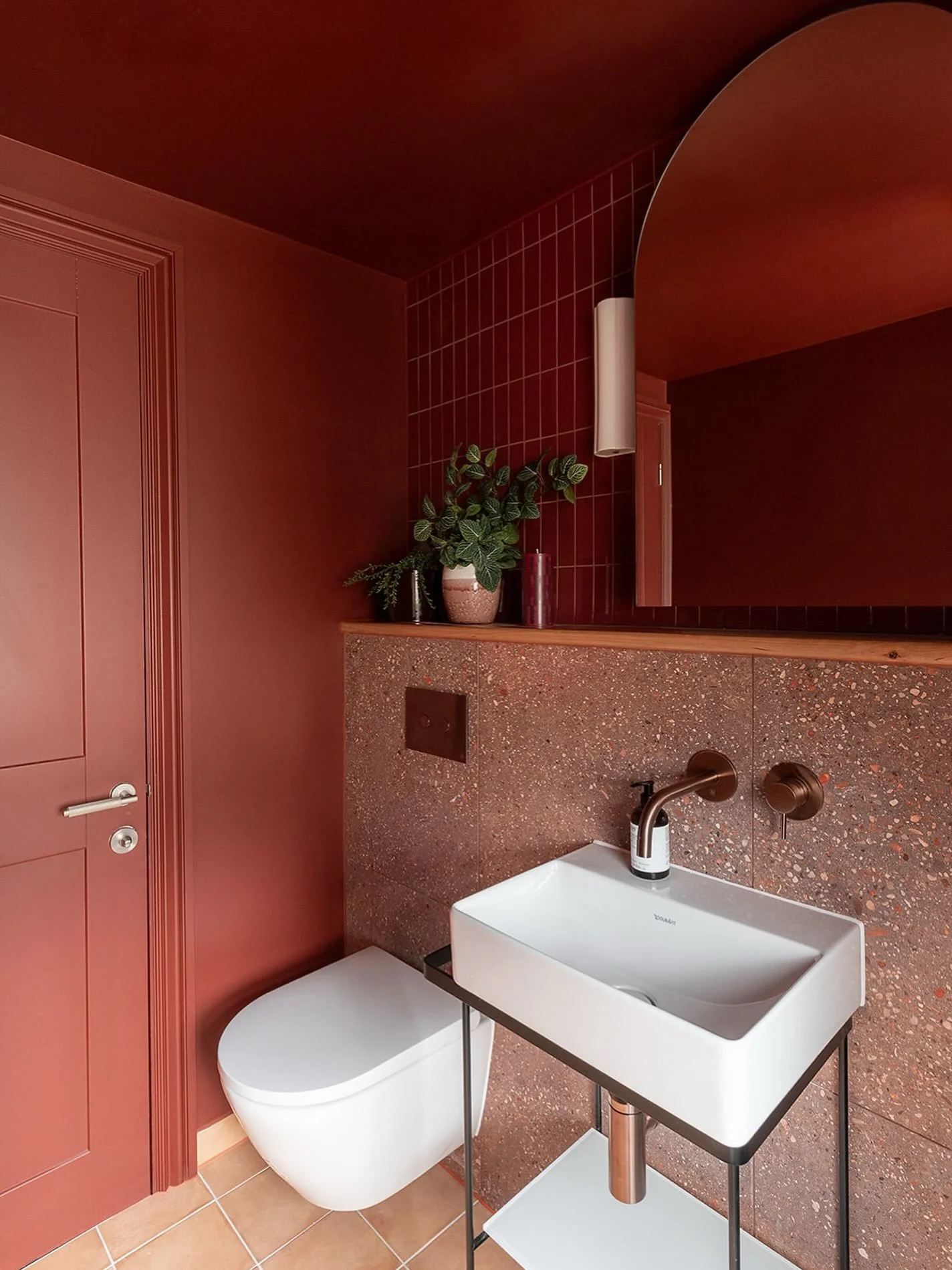 For this space, I chose an open console basin rather than a vanity unit. You can see more of the floor and wall behind it, which gives the room a lighter, less enclosed feel, while still providing a useful shelf underneath.

The wall-hung WC works in
