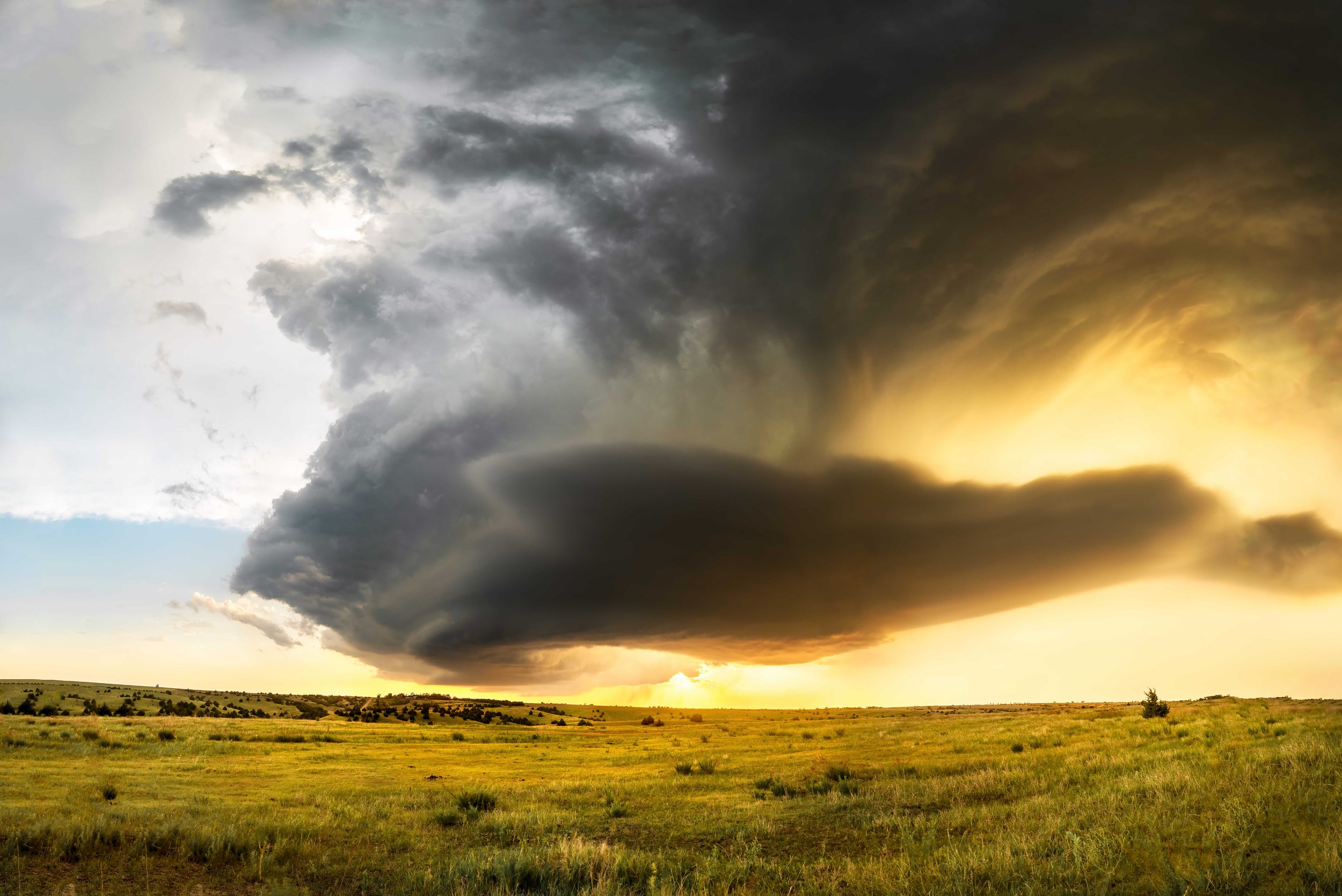 A sculpted supercell drifts southward near the town of McCook.