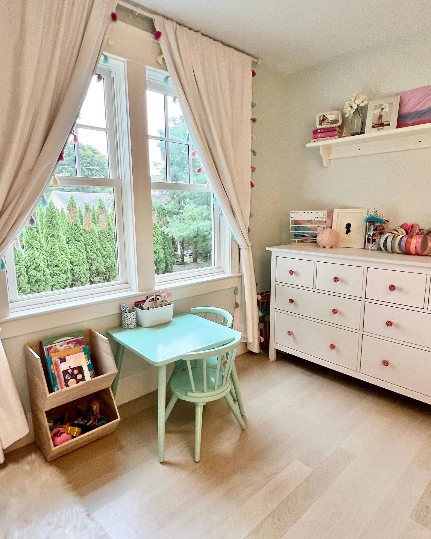 Child's bedroom craft table and dresser with organized cubes