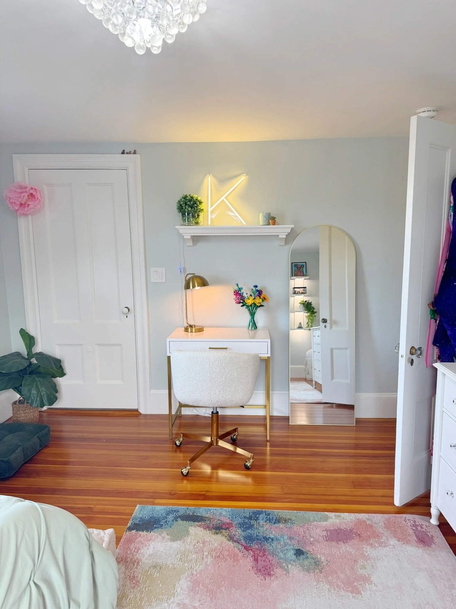 Tween girl's bedroom refresh with initial LED light, desk setup, and colorful watercolor rug.