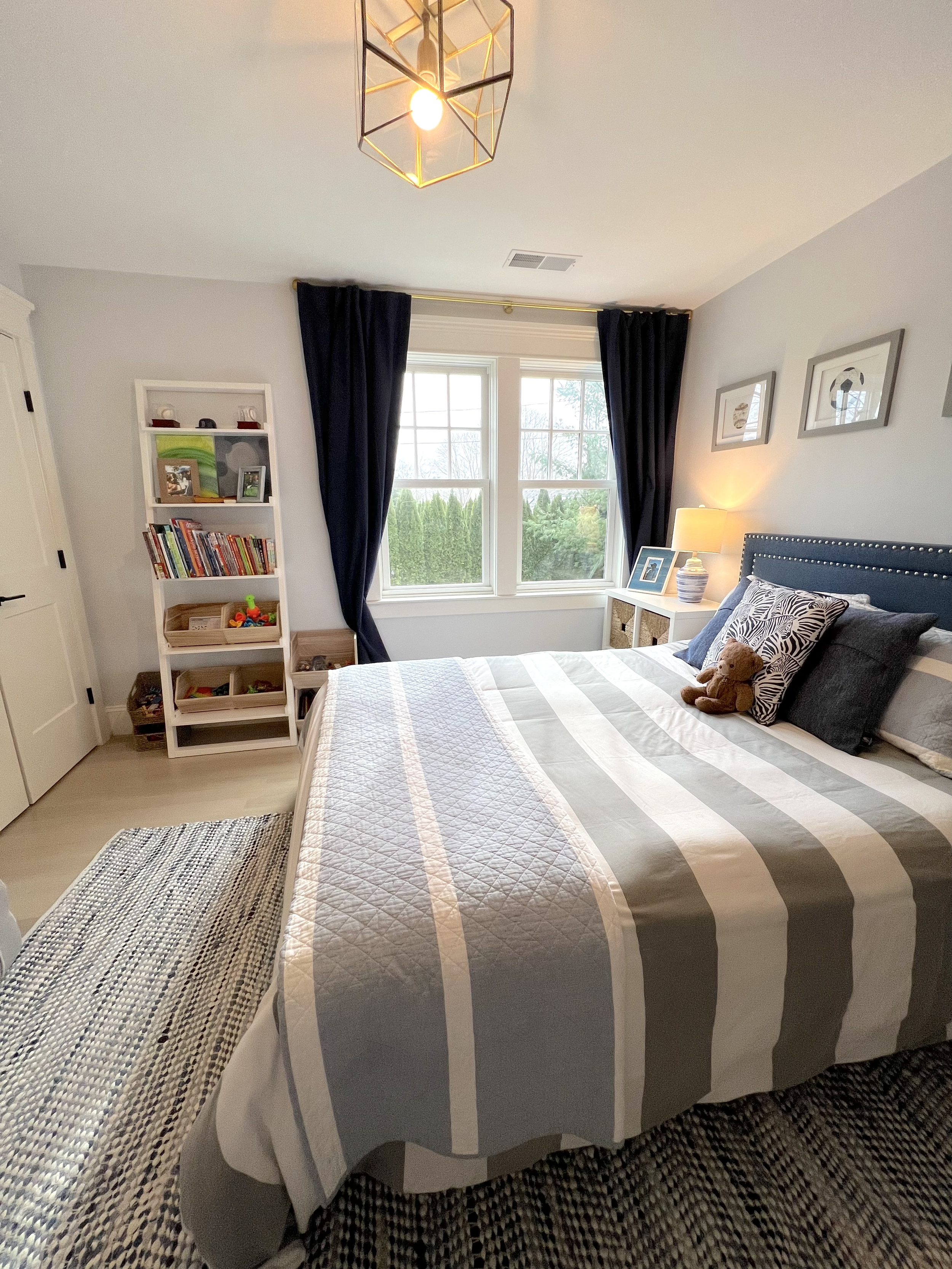 Child's bedroom with bookshelf for books, toys, and decor