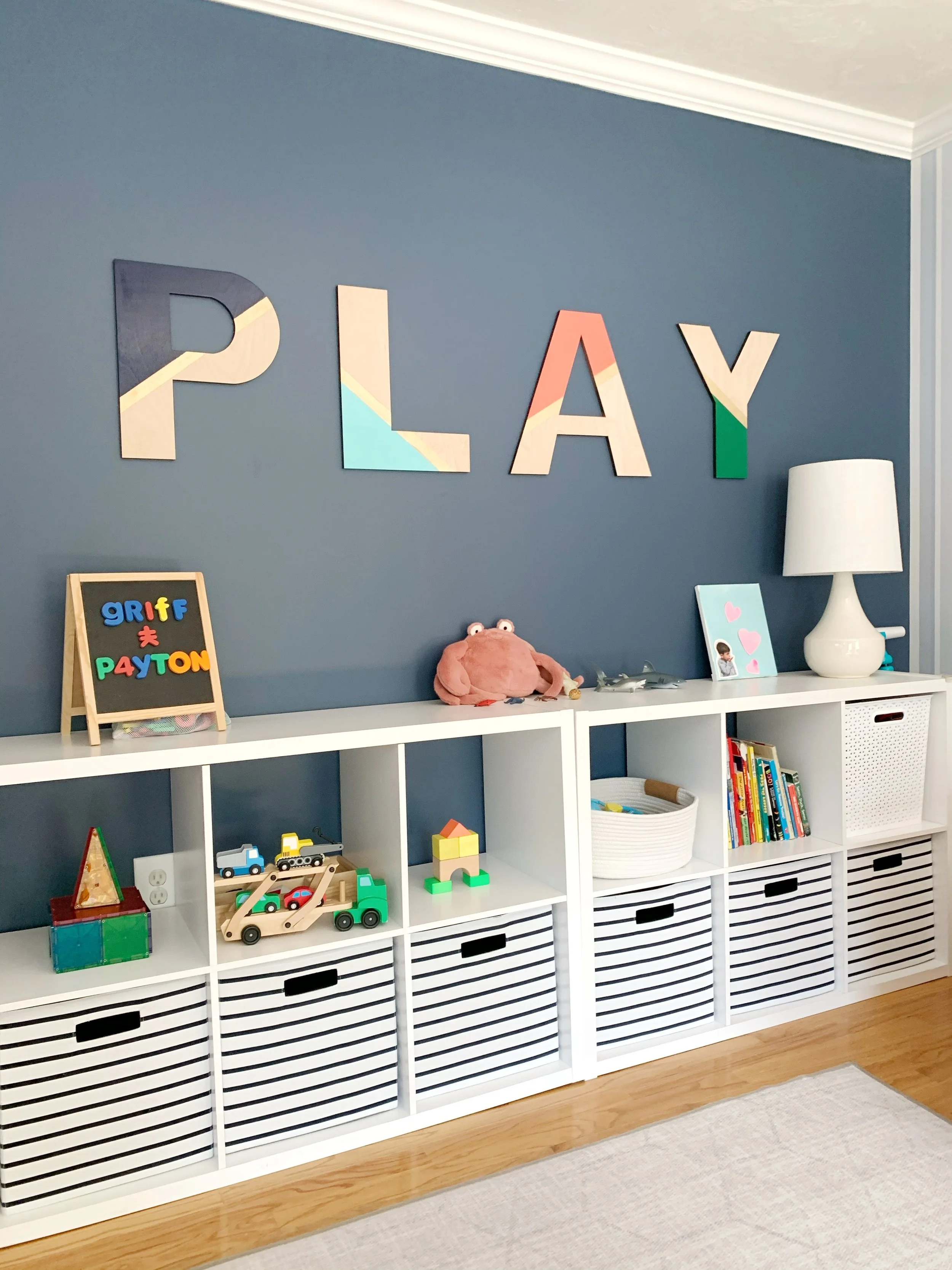 Chlid's playroom with organized IKEA cube system for toys