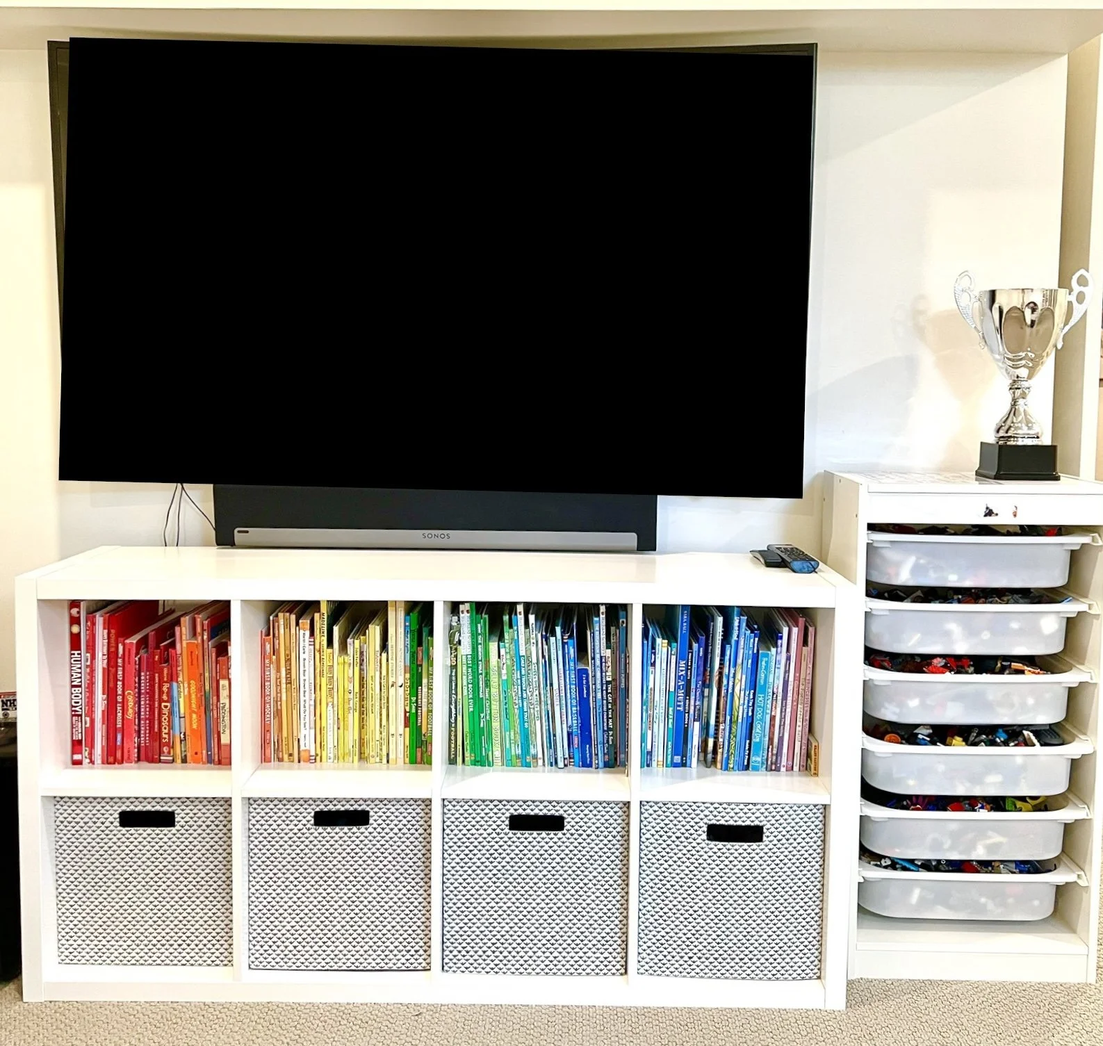 Basement playroom for child's toys and books in IKEA cube system