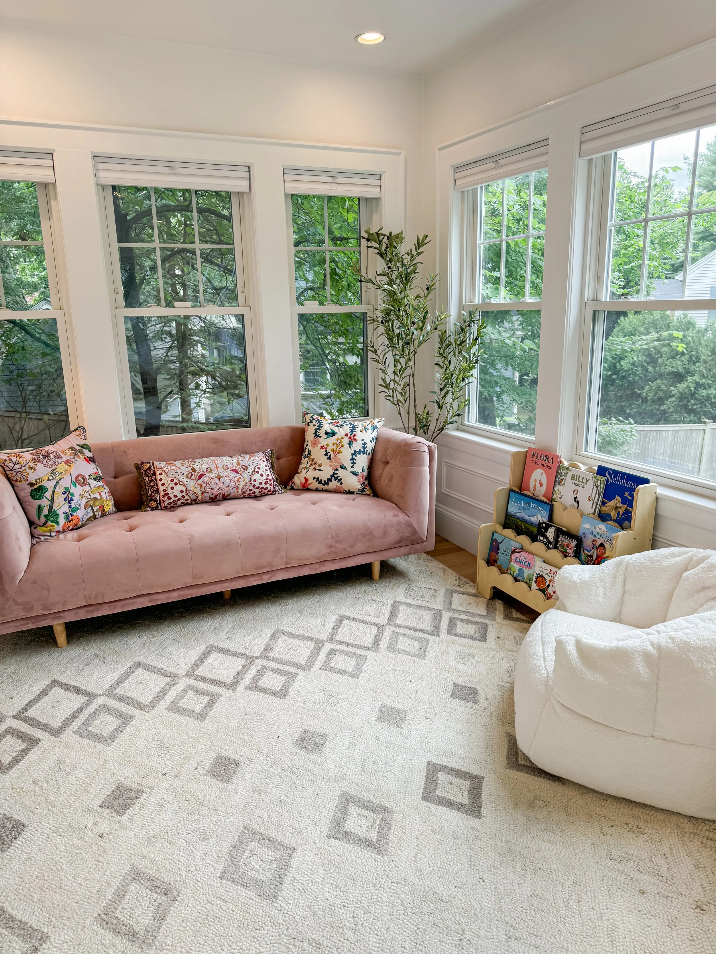 Child with their lego collection organized in clear bins