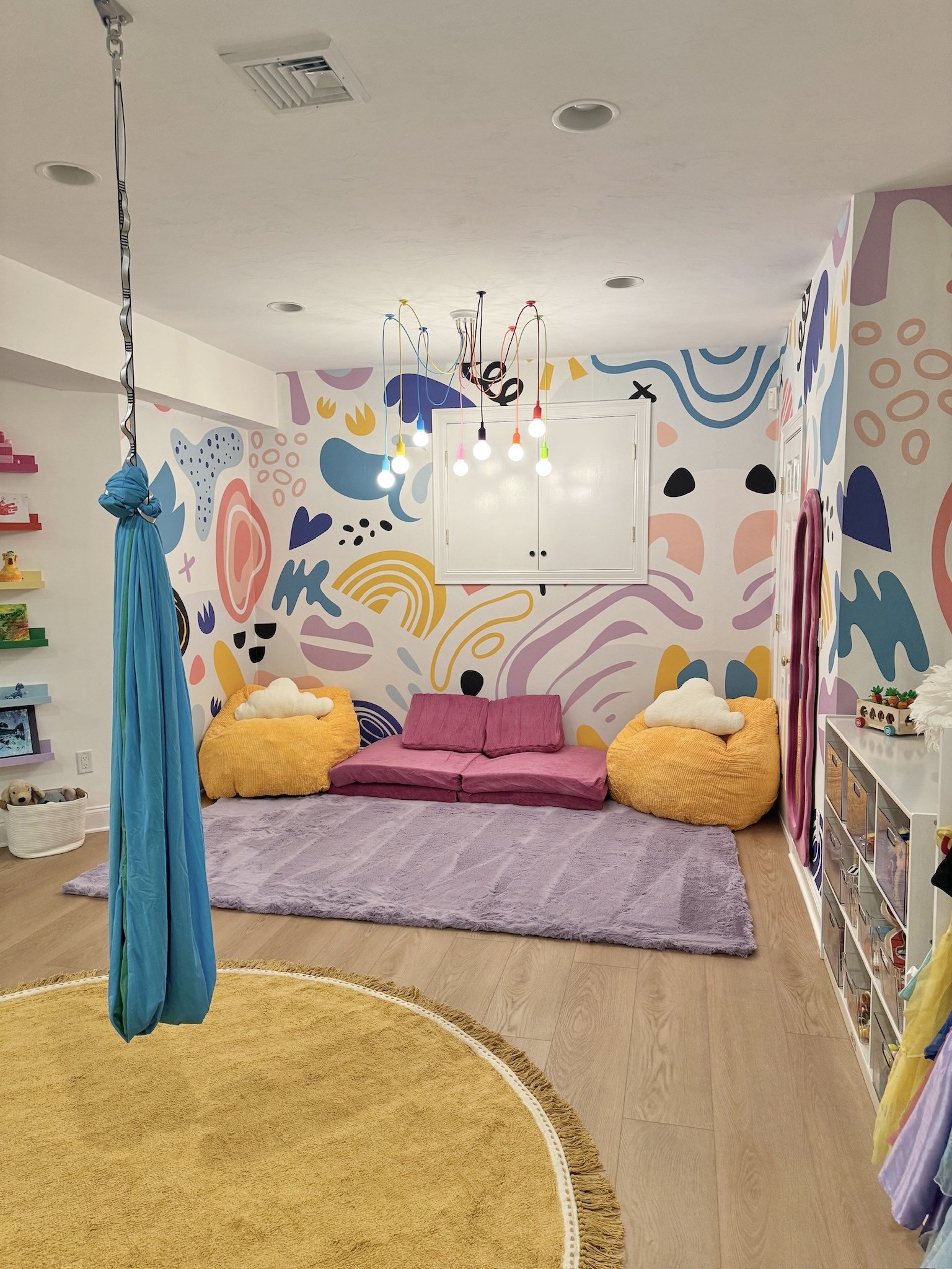 Bright colors and details make this basement playroom pop!