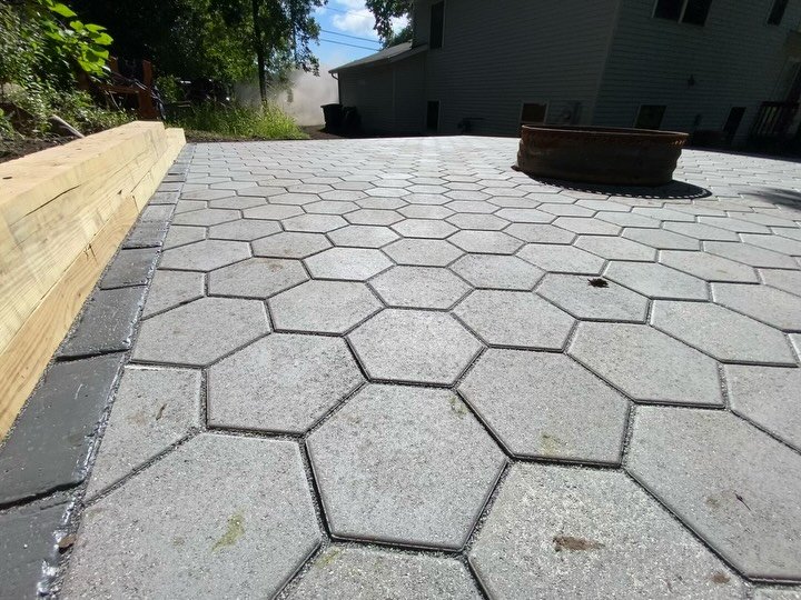 Outdoor living space with a fire pit  #unilock #pavers #patio #firpit #outdoorlivingspace