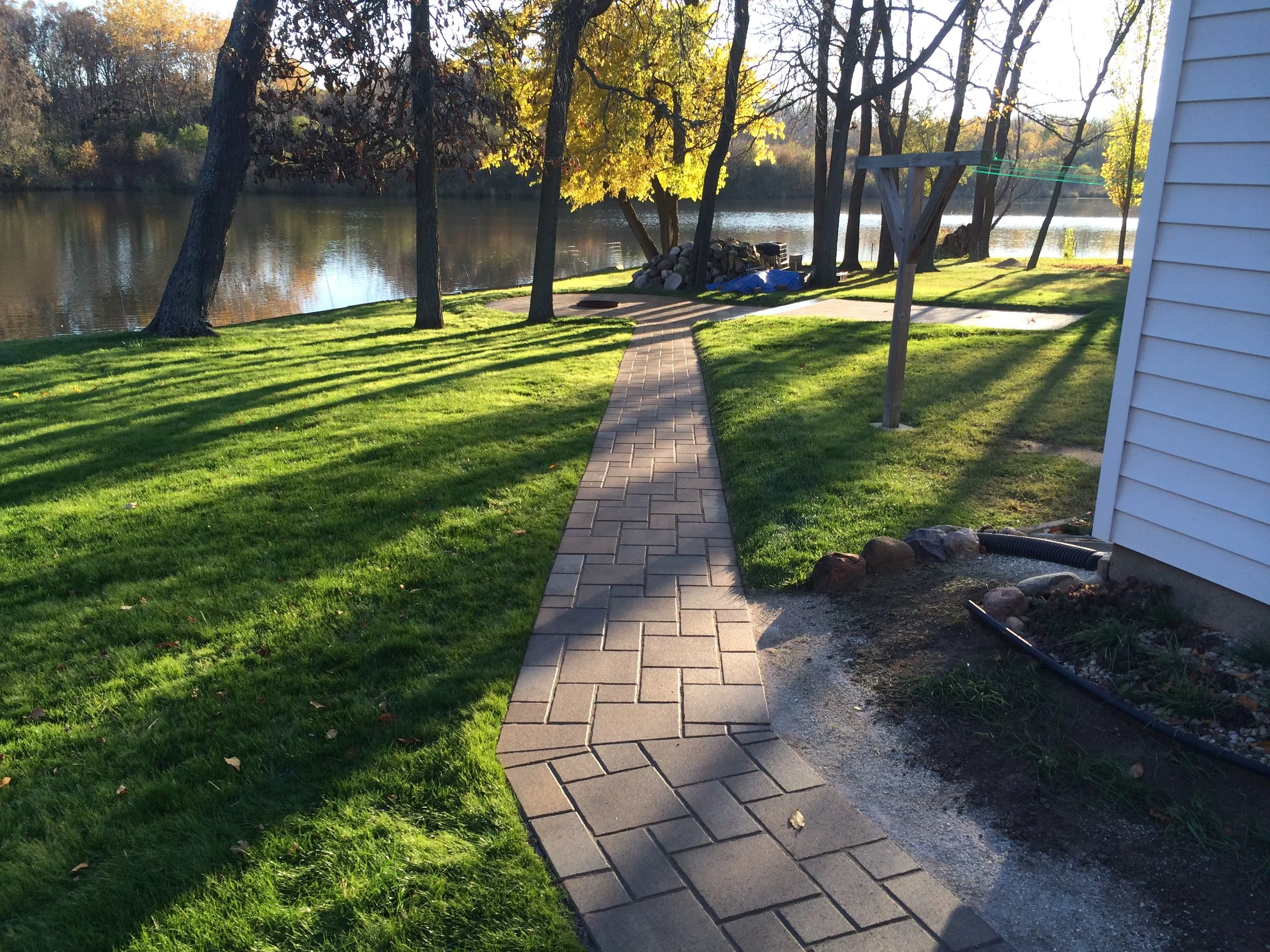 Turning the corner on a crisp new brick paver path.