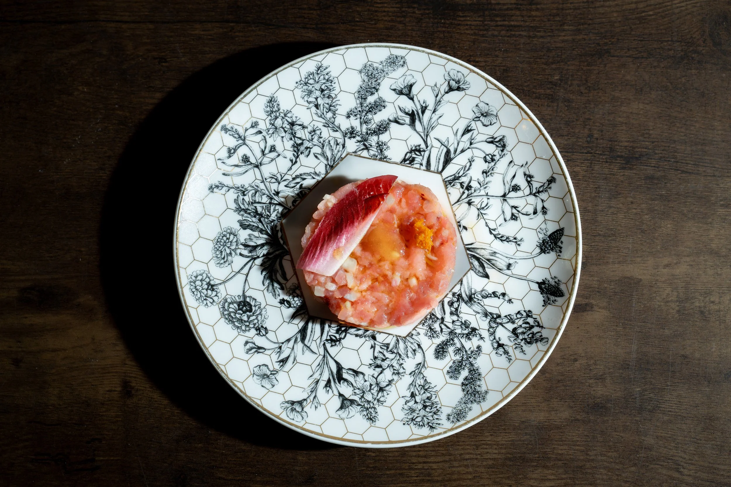 Chef-driven Italian dish served on decorative china at Lucciola NYC