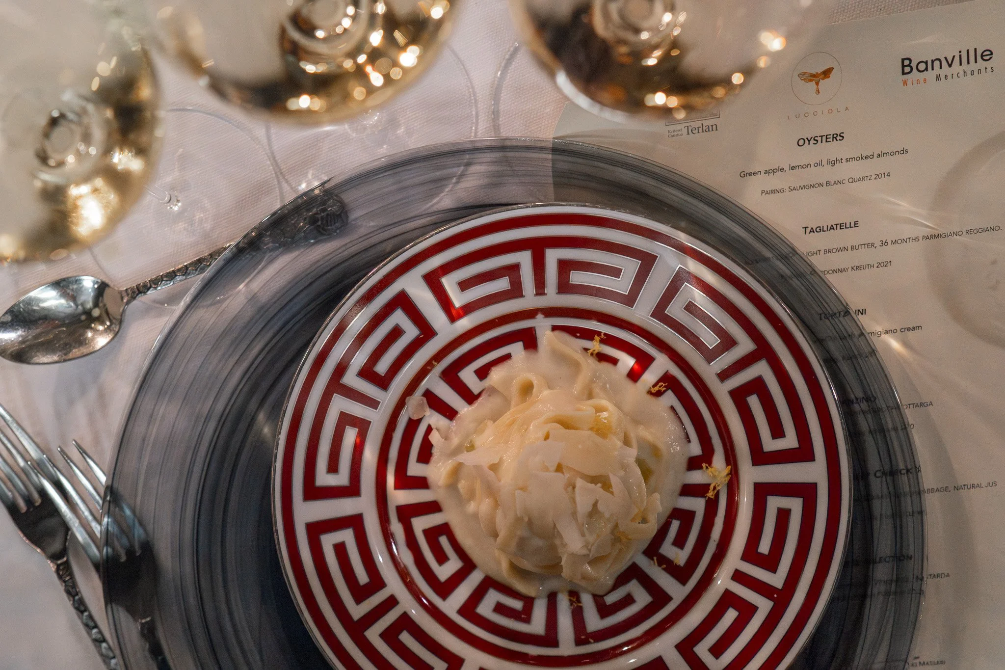 felicetti pasta on ginori plate with parmigiano reggiano and white wine terlano