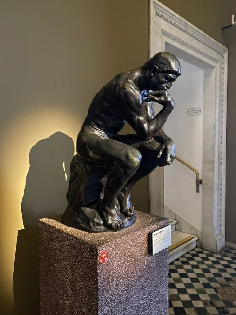 Visitors admiring Vatican Museum frescoes