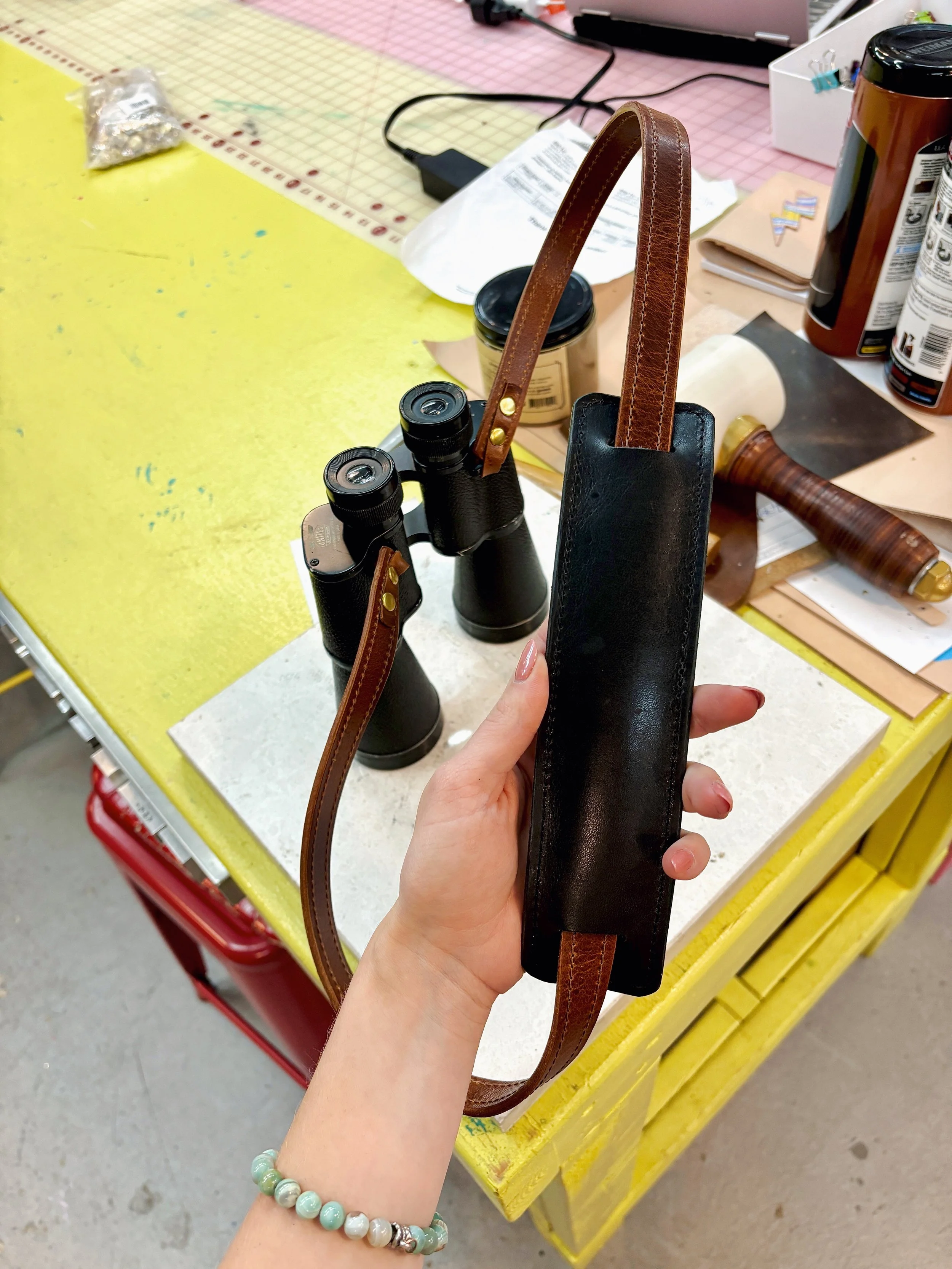 Leather binocular strap.