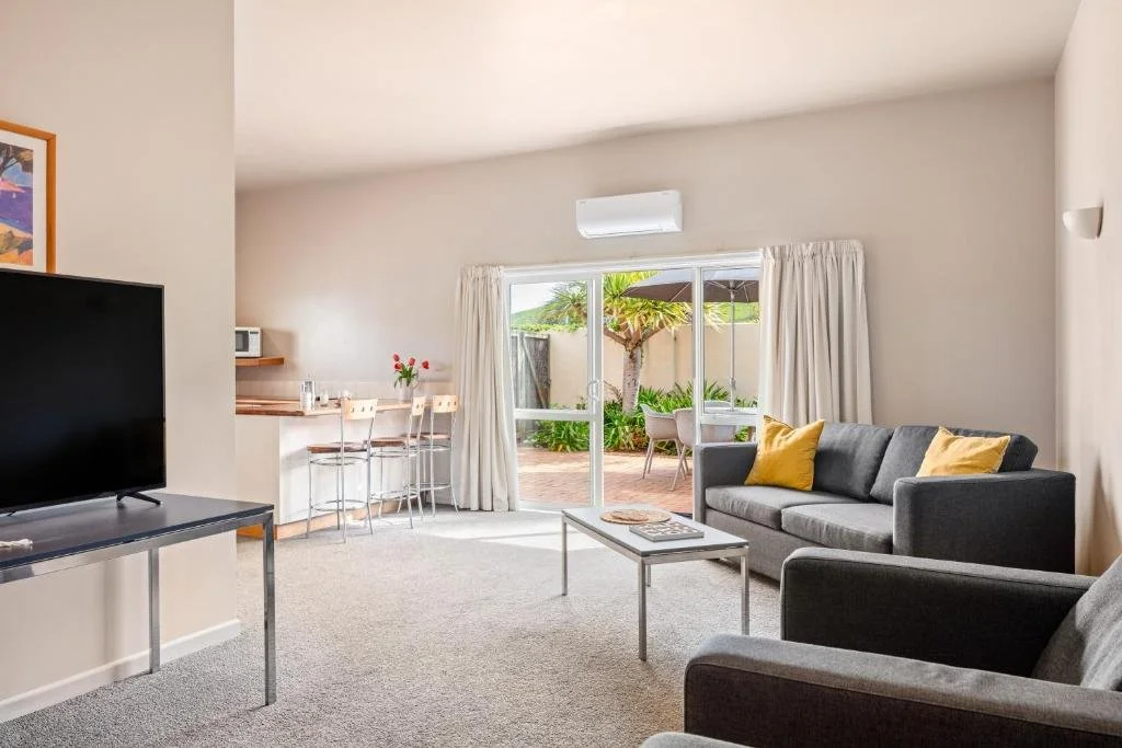 Ocean-Beach-Wainui-2 Bedroom-Suite-Lounge-and-Outdoor-Area.jpg