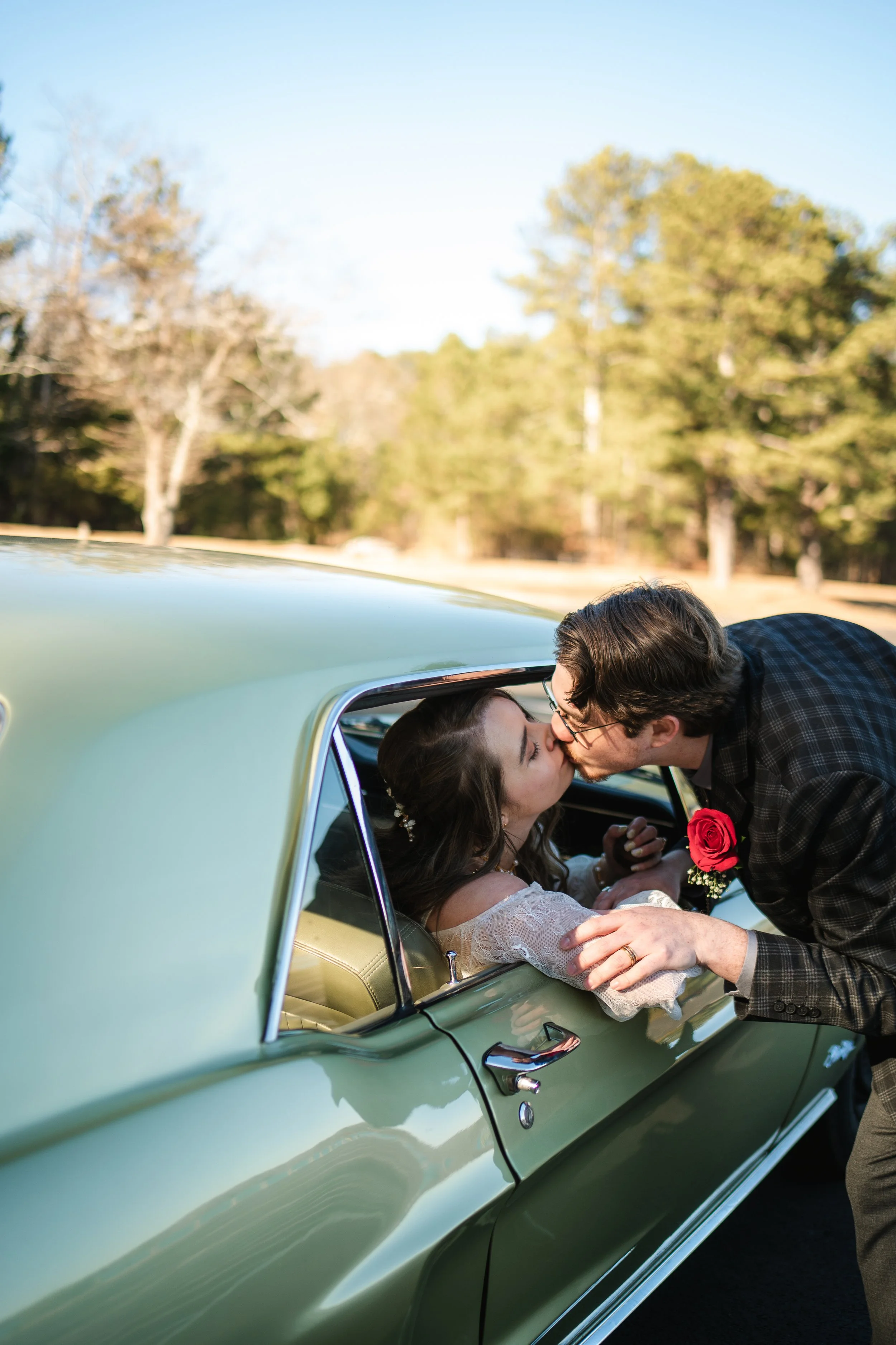 bride and groom with vintage car