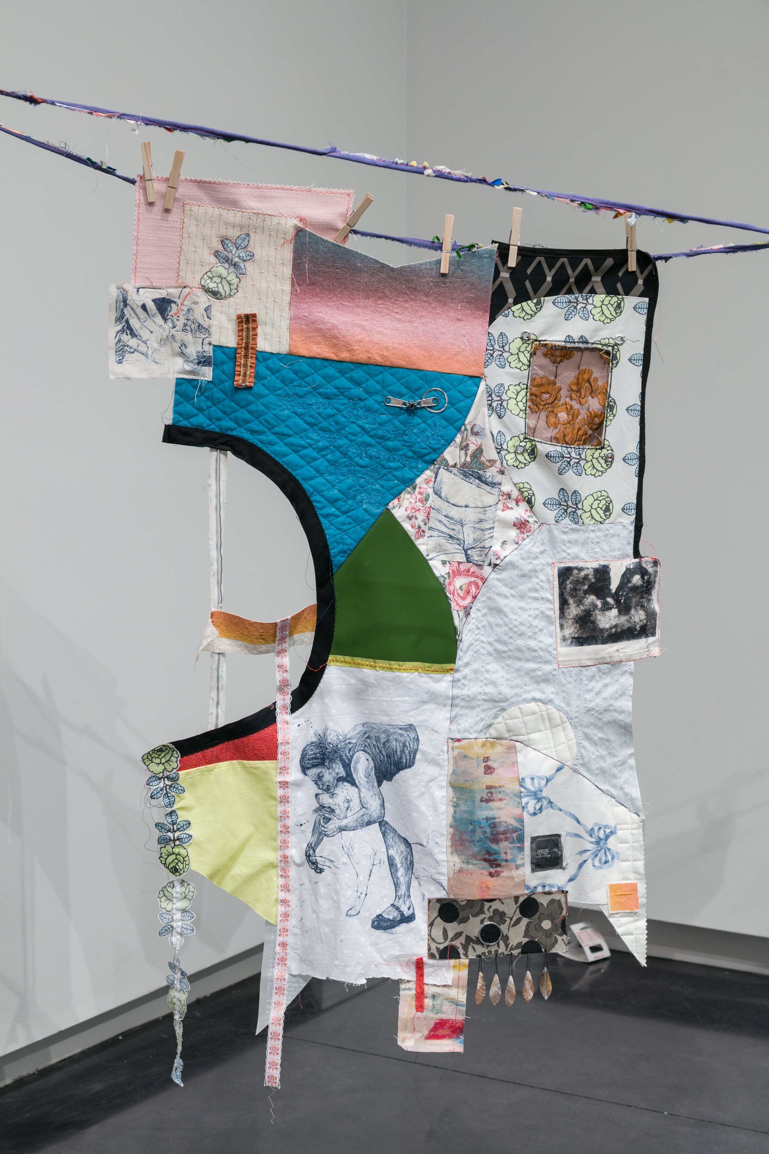Be a Woman About It; lithograph, collage, quilt binding, zippers, key rings, beads, thread, and various fabrics; 2024