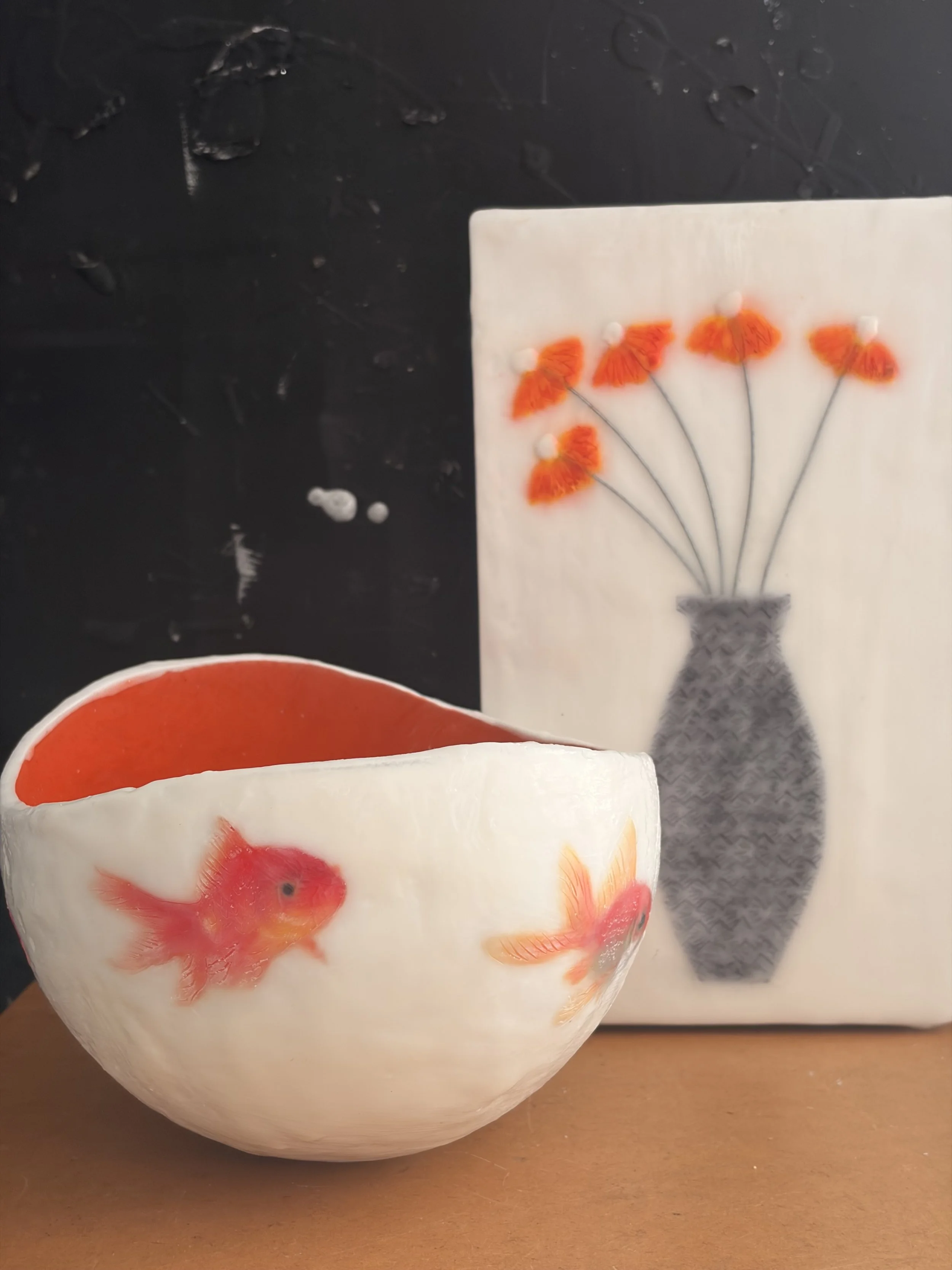 Handmade encaustic wax vessel with luminous  white exterior and goldfish design, featuring soft translucent layers and a warm orange interior, 17 x 13 cm sculptural art bowl.