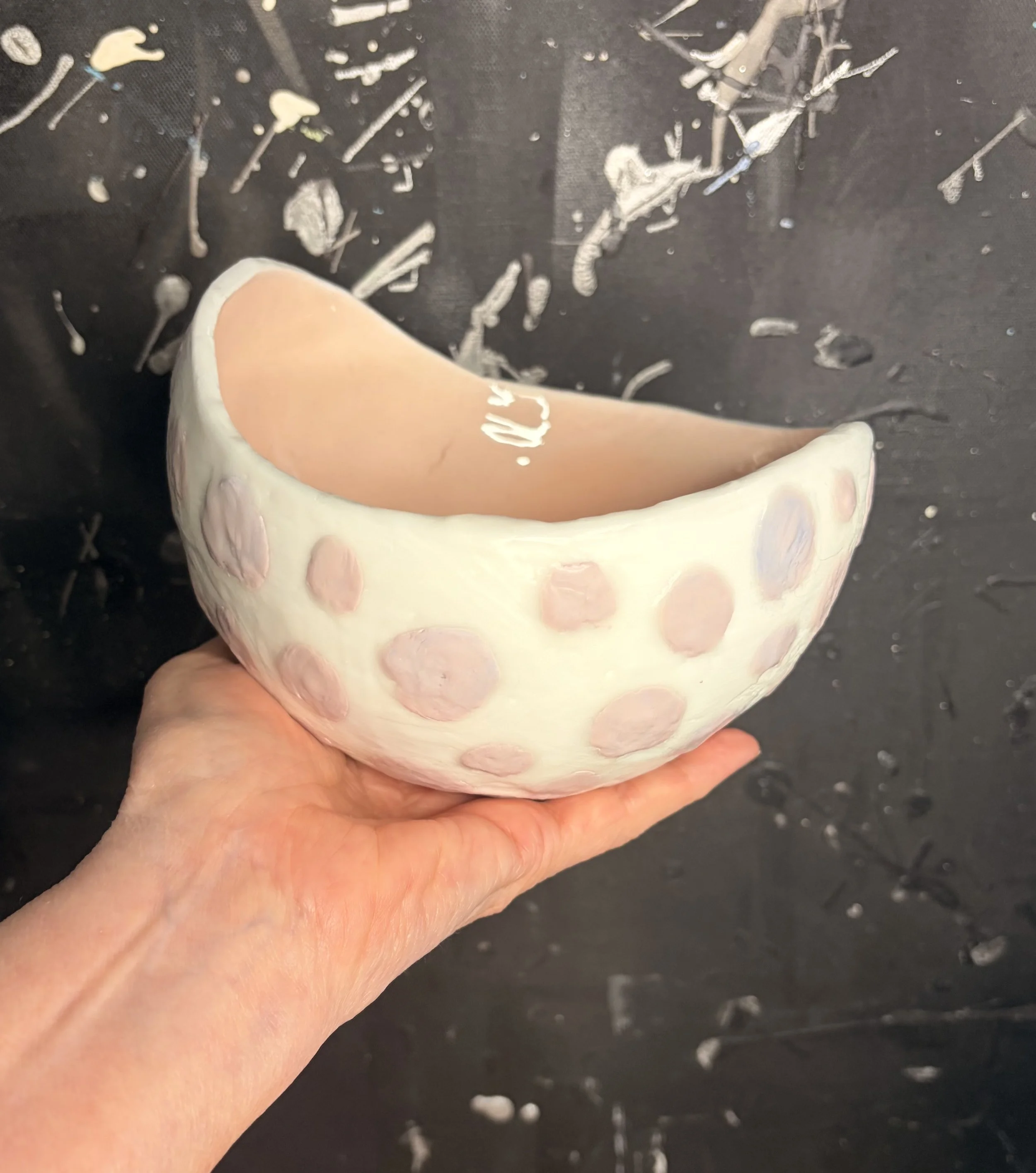 Original encaustic wax and resin vessel titled Musk Stick by Australian artist Karen Canning featuring soft blush pink raised dots on an ivory beeswax surface with a glossy pale pink resin interior.