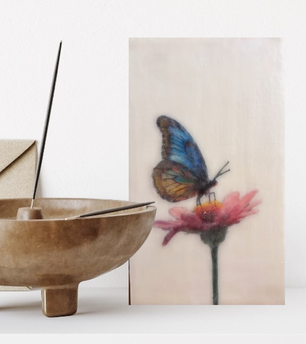 A blue and gold butterfly resting on a pink flower, rendered in luminous encaustic wax and mixed media with a dreamy, ethereal finish.