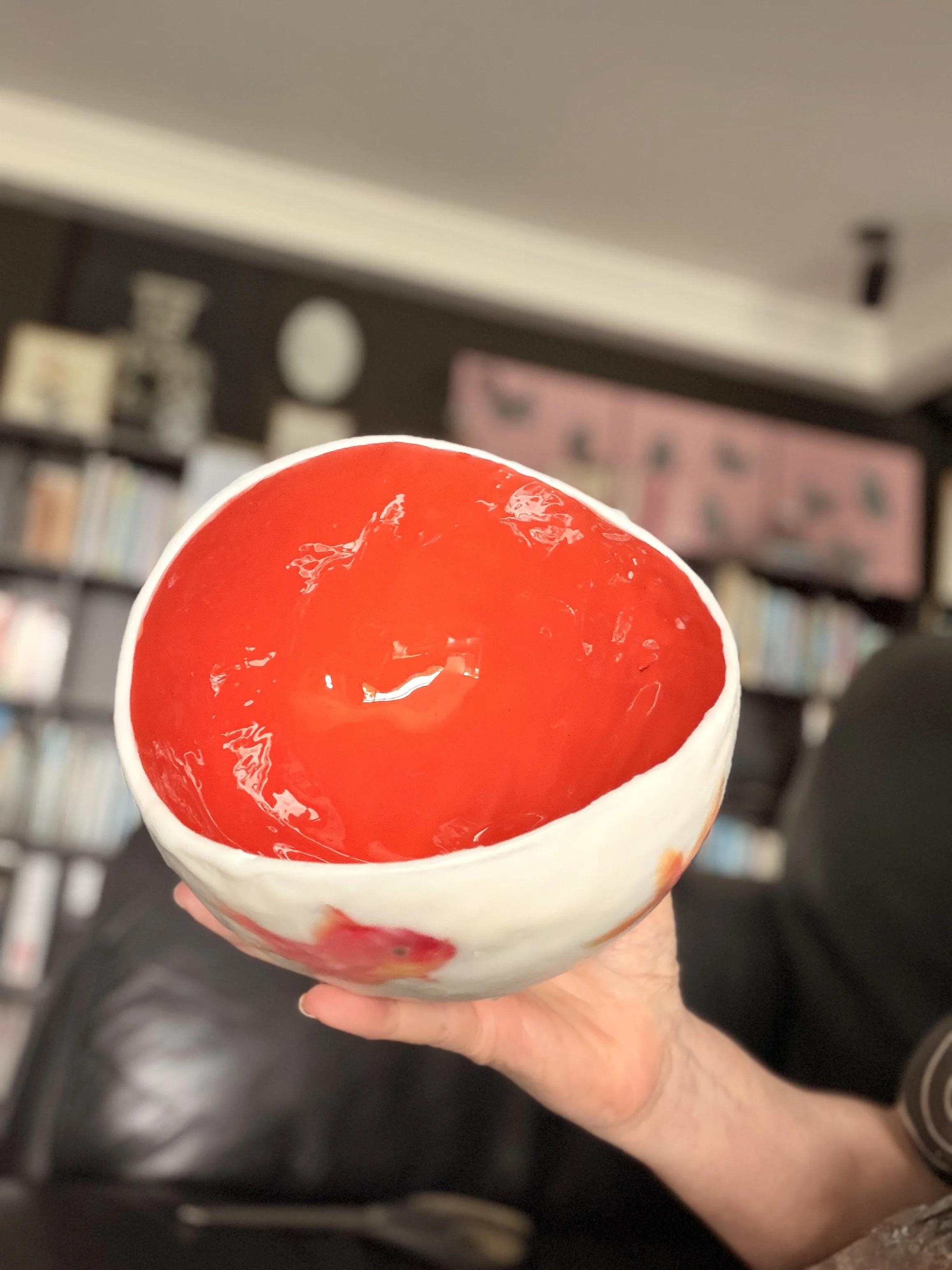 Handmade encaustic wax vessel with luminous  white exterior and goldfish design, featuring soft translucent layers and a warm orange interior, 17 x 13 cm sculptural art bowl.