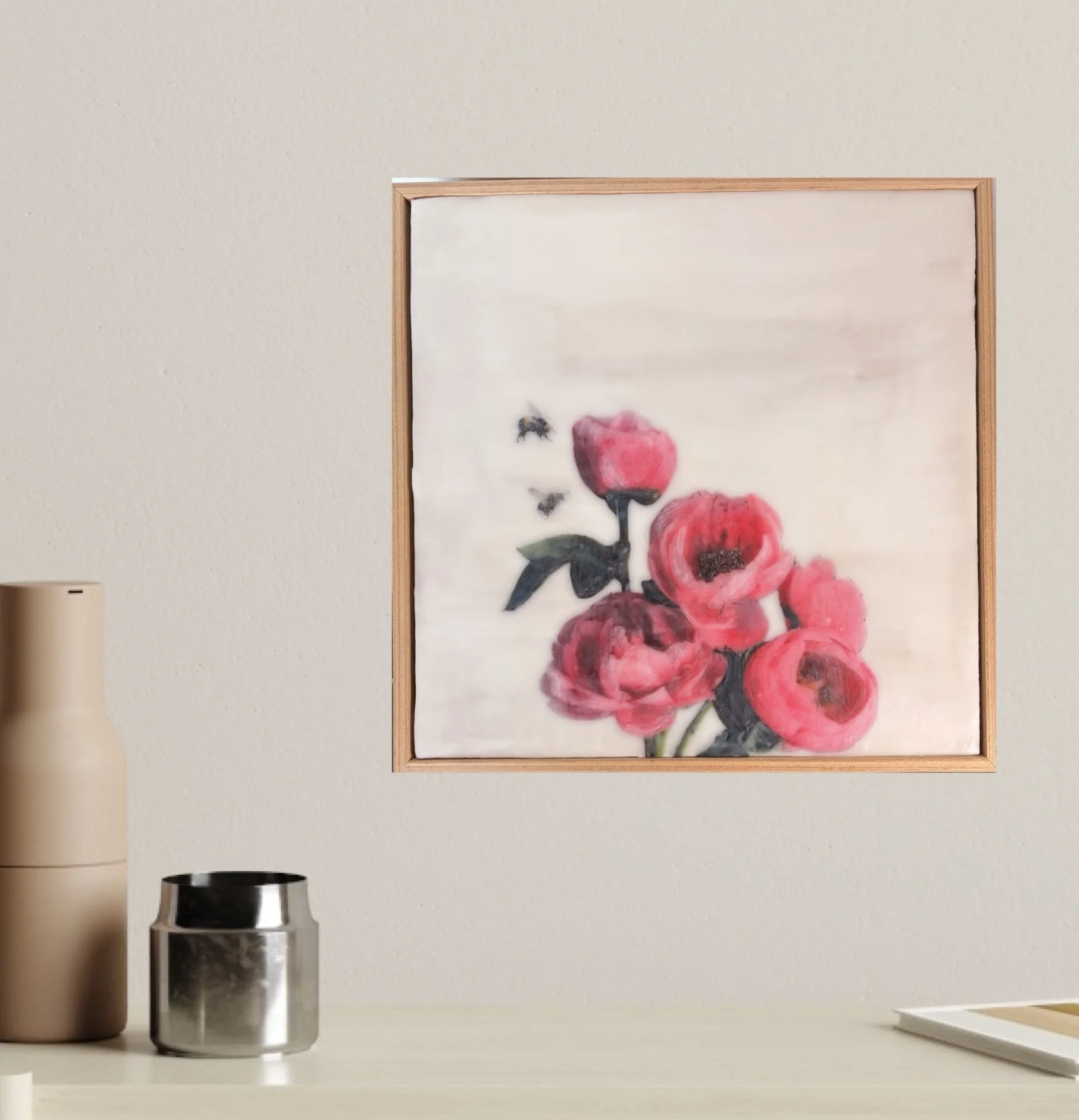 an encaustic wax/mixed media artwork of soft pink flowers and two bees