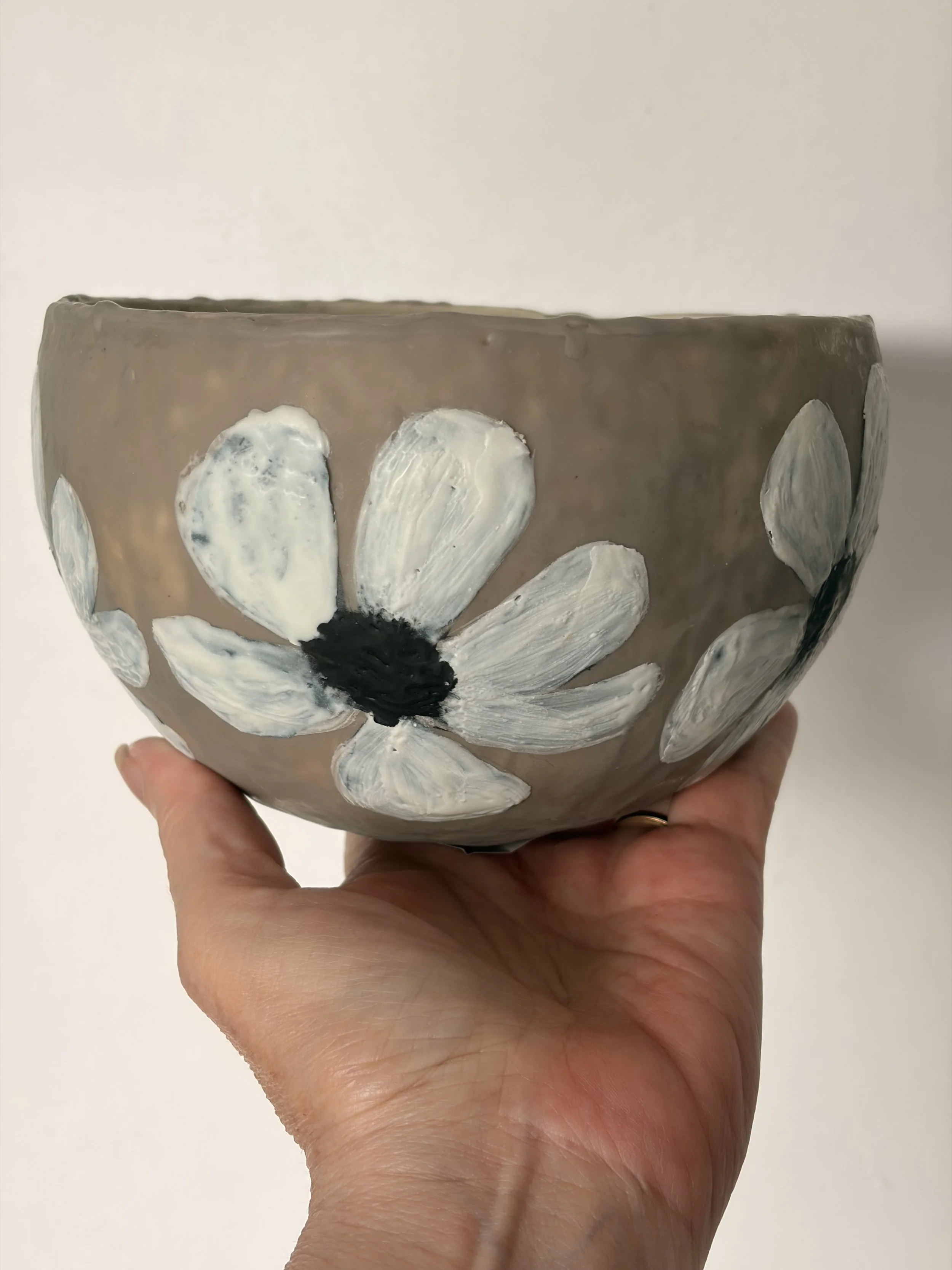 Small encaustic wax artwork titled “Hello Daisy” featuring a delicate daisy motif, layered beeswax texture, and a soft glossy resin interior, handmade by Australian artist Karen Canning.