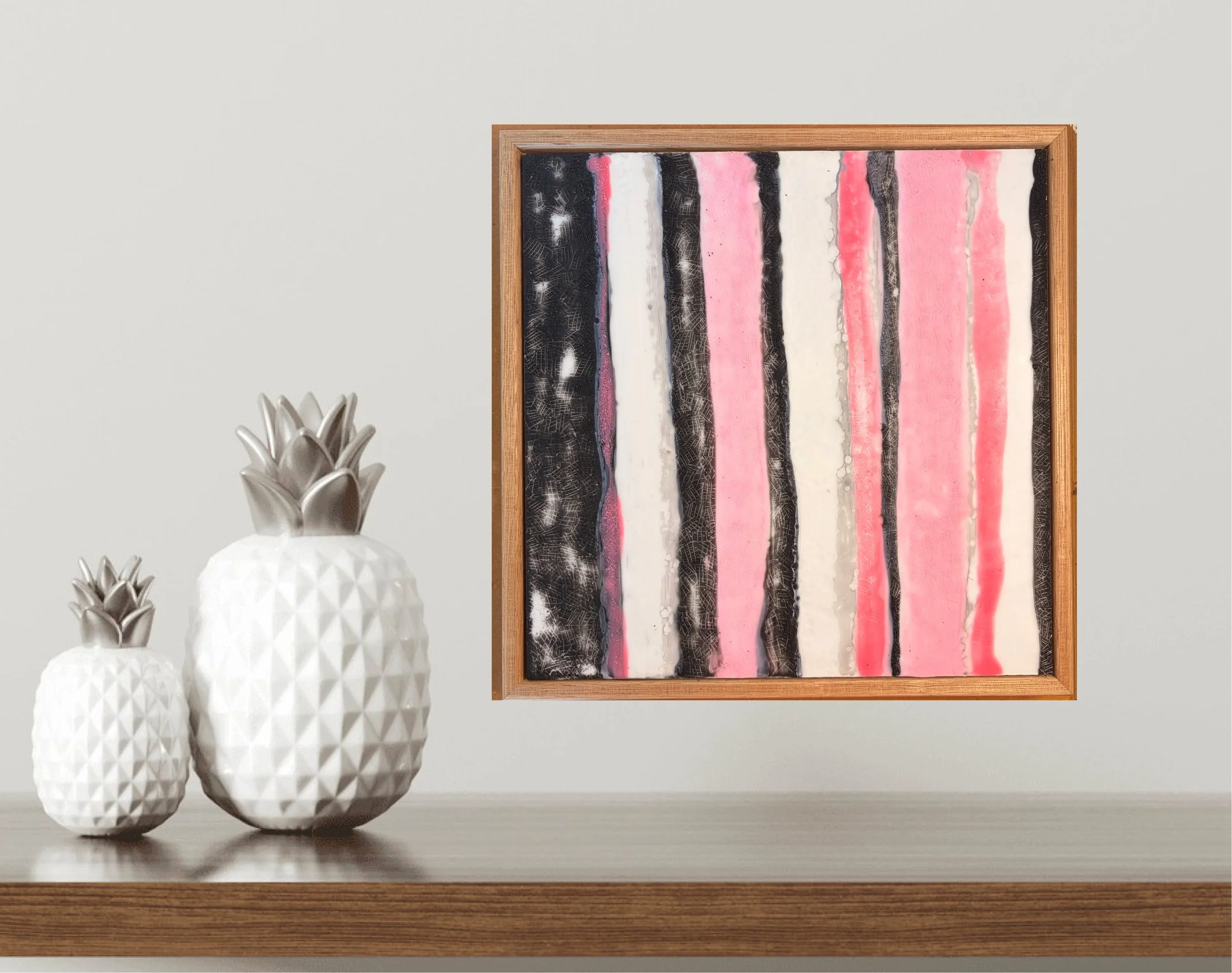 Close-up and full views of a framed encaustic wax artwork featuring vertical pink, black, and white textured stripes, displayed in a timber frame on a light background.