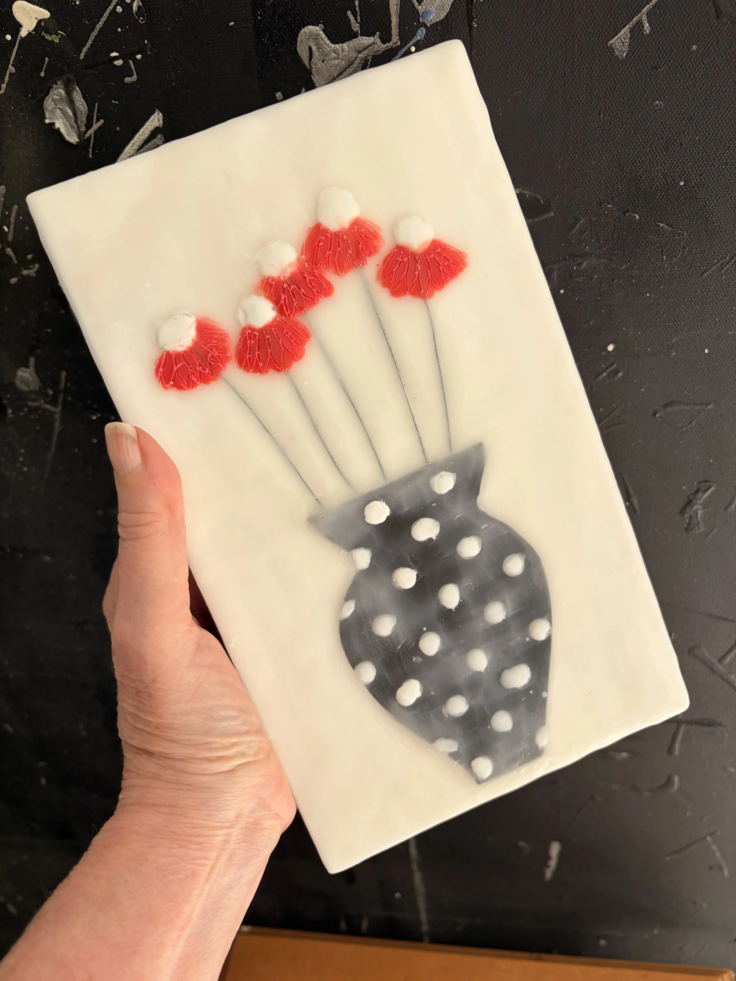 Encaustic wax and mixed media block artworks featuring stylised vases with delicate pink and orange flowers on textured white backgrounds, arranged as a cohesive decorative series.