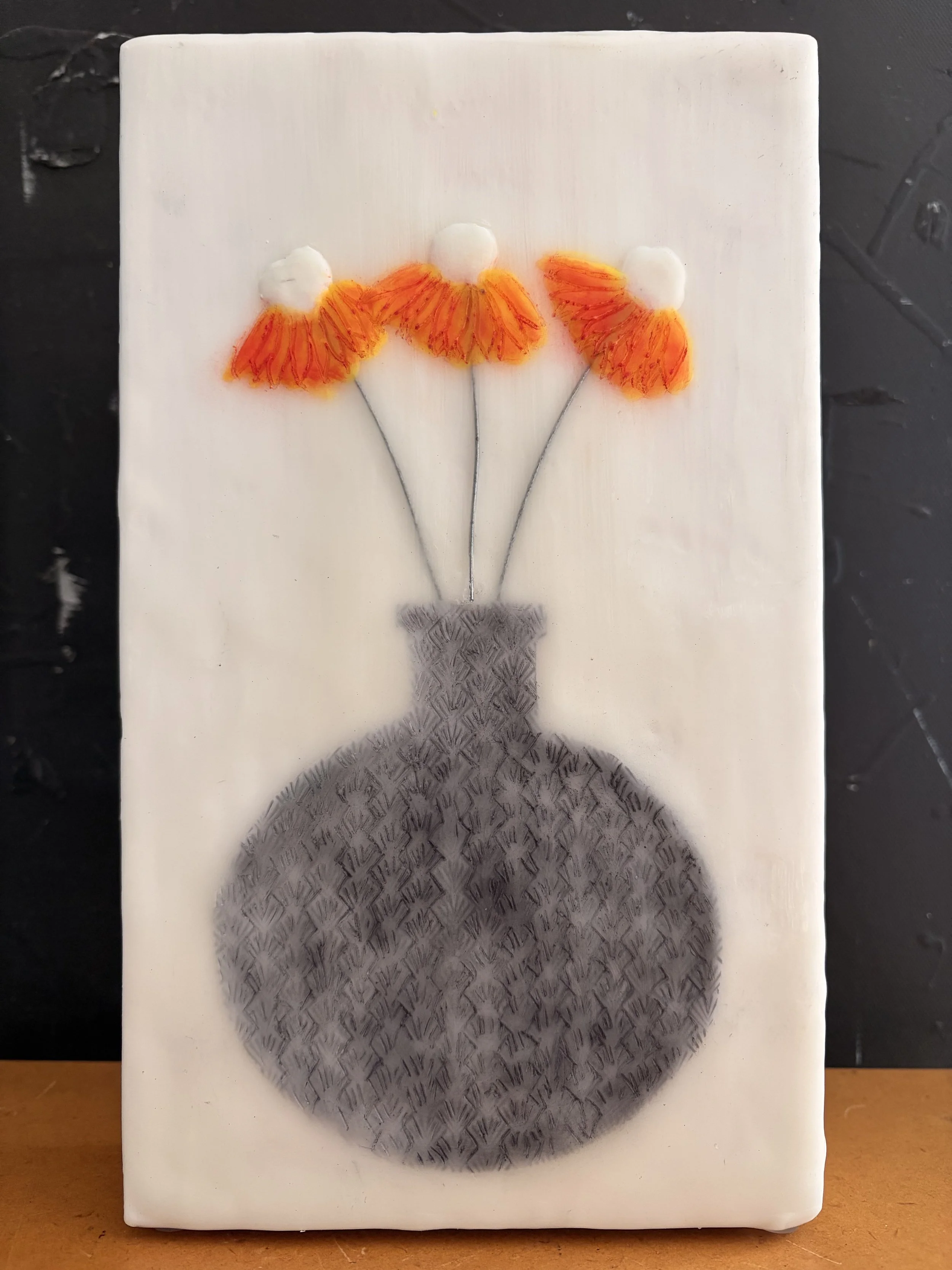 Encaustic wax and mixed media block artworks featuring stylised vases with delicate pink and orange flowers on textured white backgrounds, arranged as a cohesive decorative series.