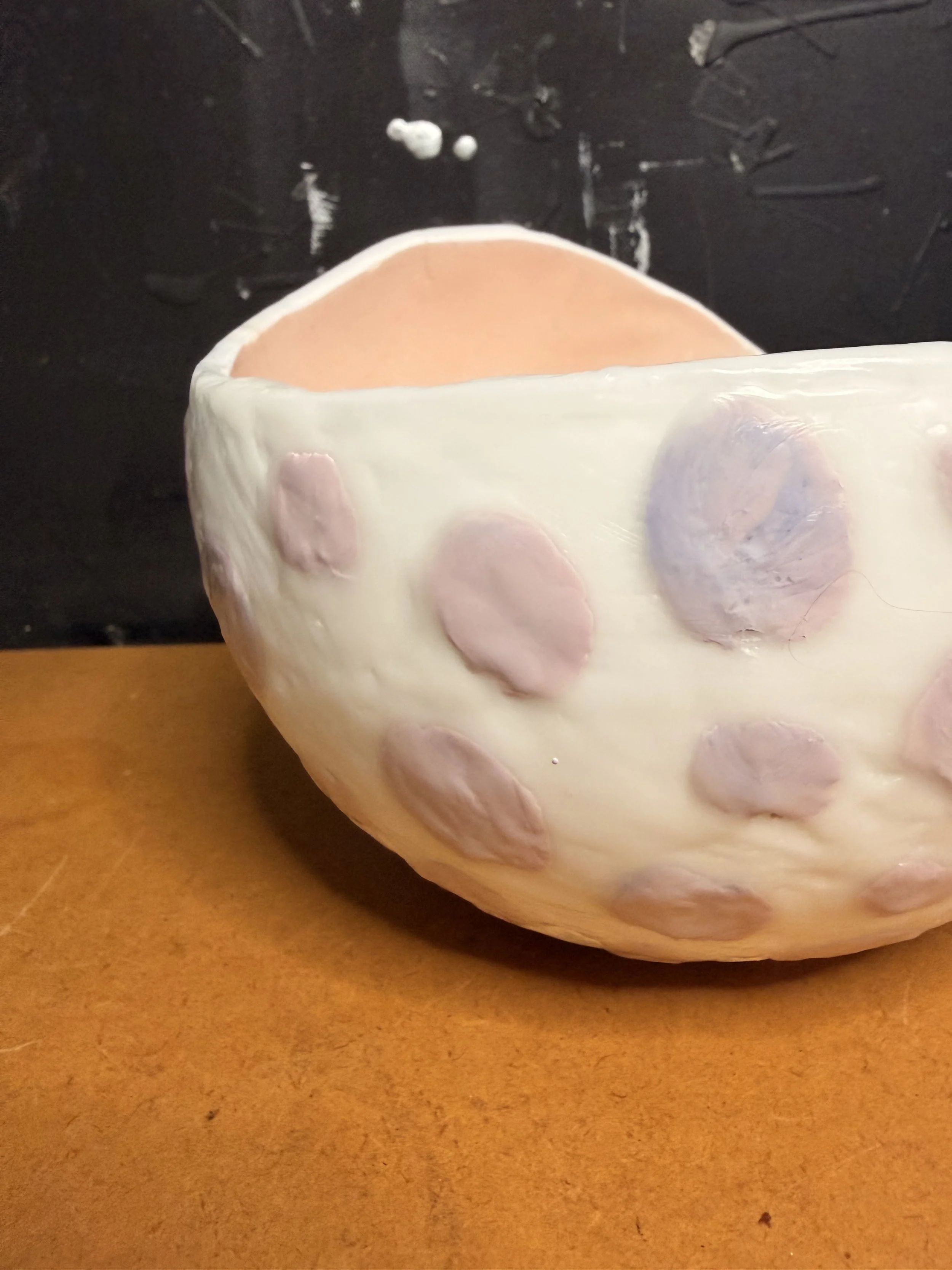 Original encaustic wax and resin vessel titled Musk Stick by Australian artist Karen Canning featuring soft blush pink raised dots on an ivory beeswax surface with a glossy pale pink resin interior.