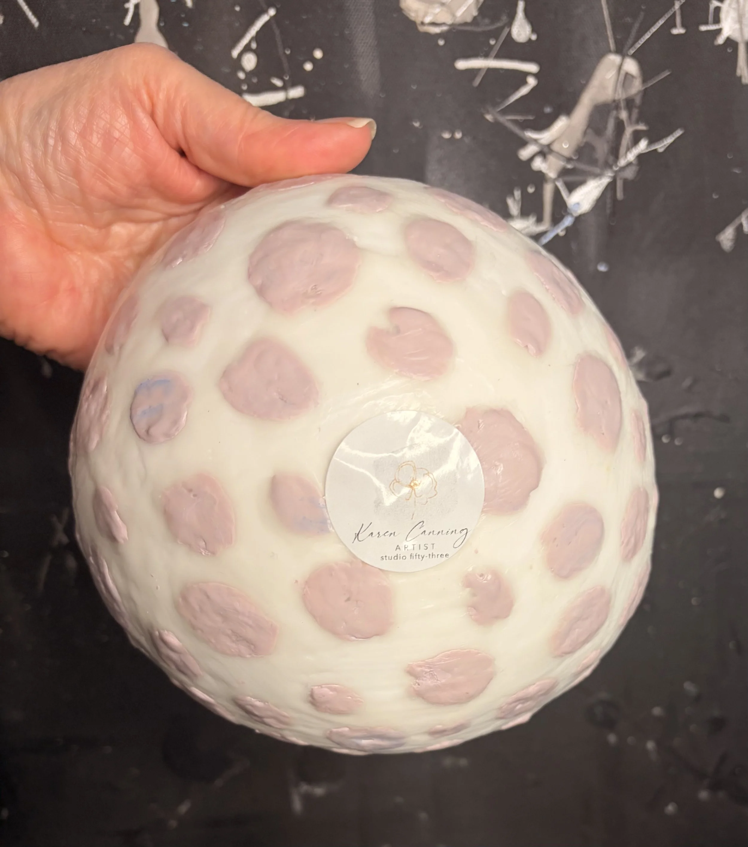 Original encaustic wax and resin vessel titled Musk Stick by Australian artist Karen Canning featuring soft blush pink raised dots on an ivory beeswax surface with a glossy pale pink resin interior.