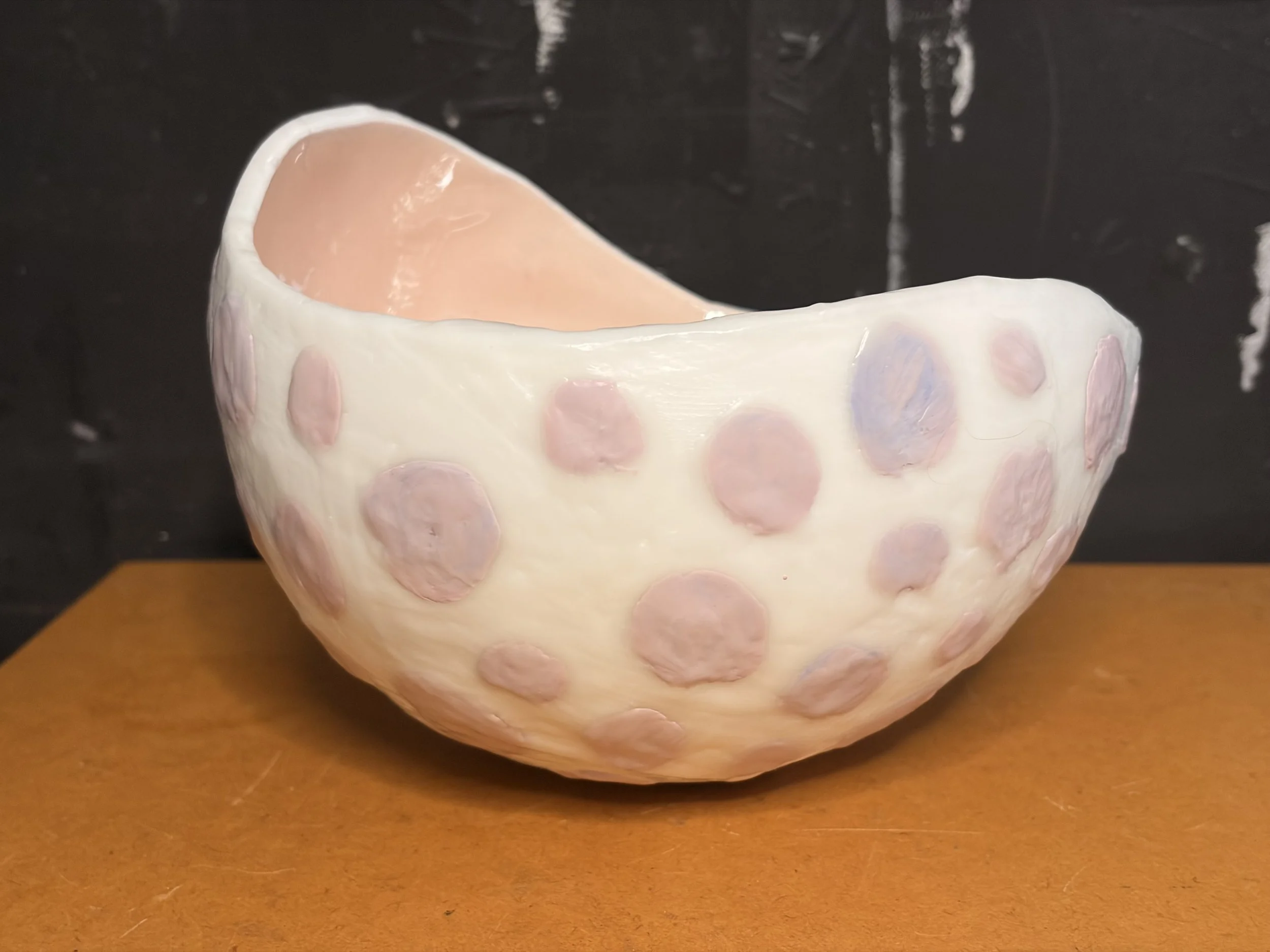 Original encaustic wax and resin vessel titled Musk Stick by Australian artist Karen Canning featuring soft blush pink raised dots on an ivory beeswax surface with a glossy pale pink resin interior.