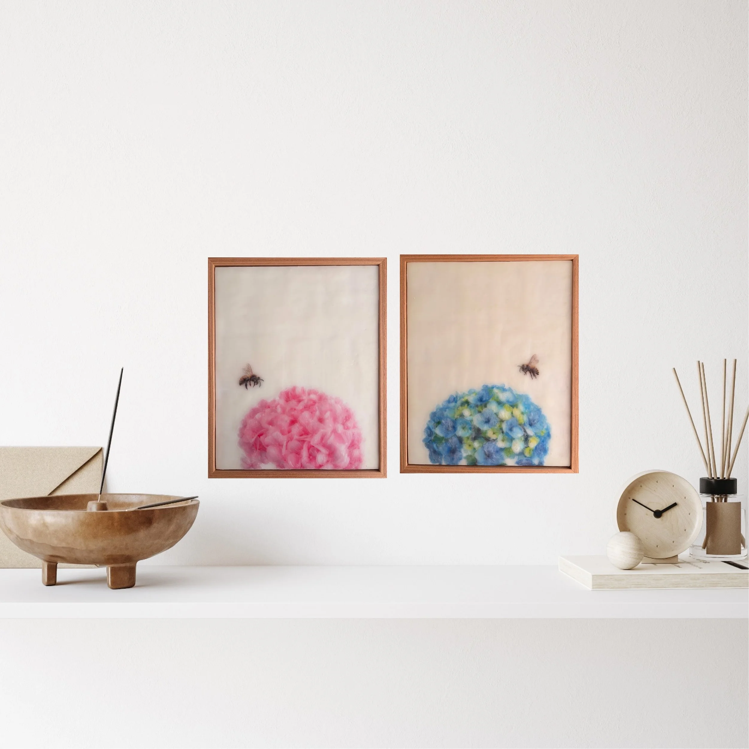Original encaustic wax artwork of a honeybee hovering beside soft pink hydrangea flowers, framed in Tasmanian oak with a dreamy, luminous botanical finish.