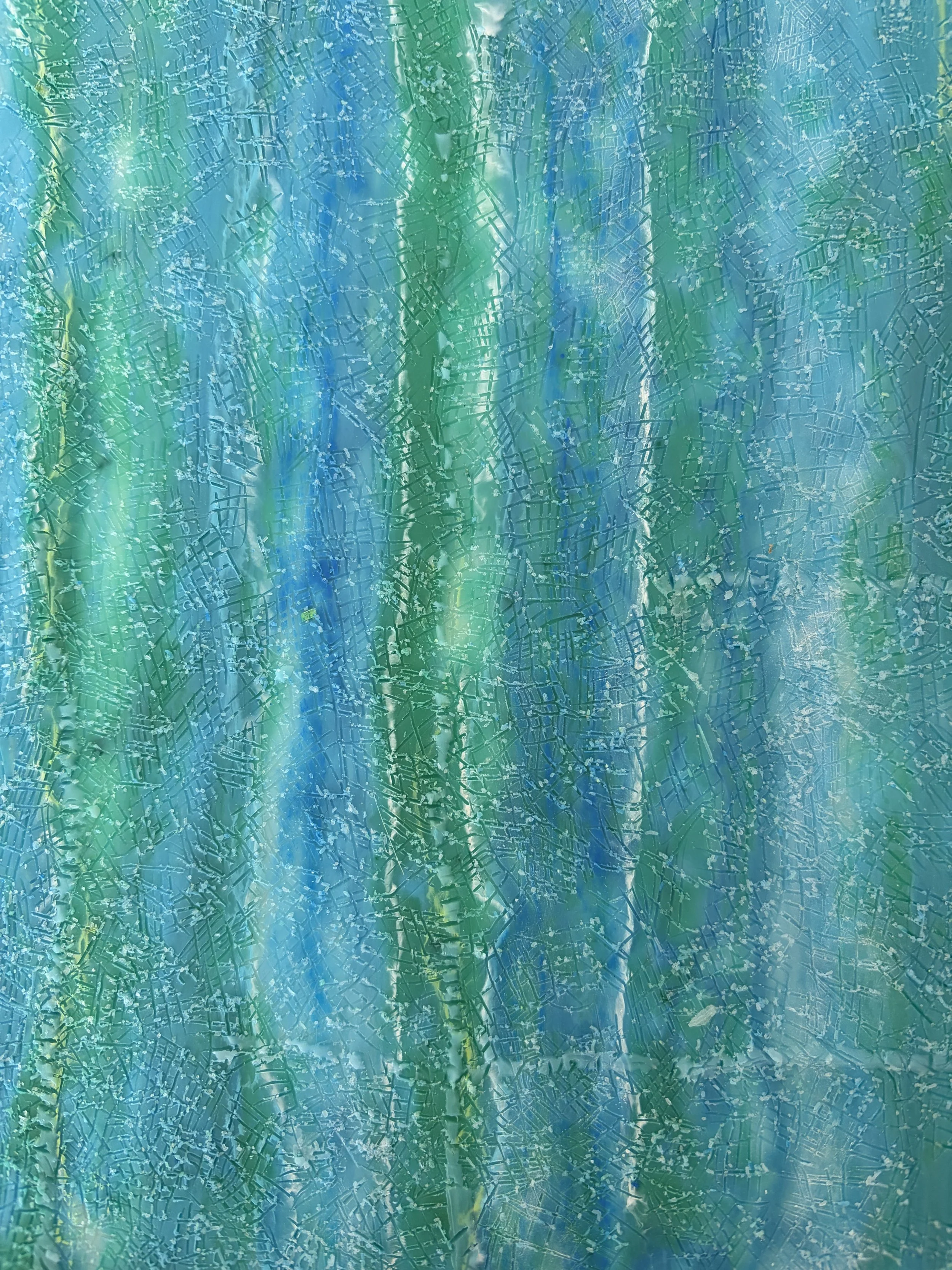 “A square 30 x 30cm encaustic wax and mixed media artwork featuring layered blue and green abstract textures, framed in natural timber.”