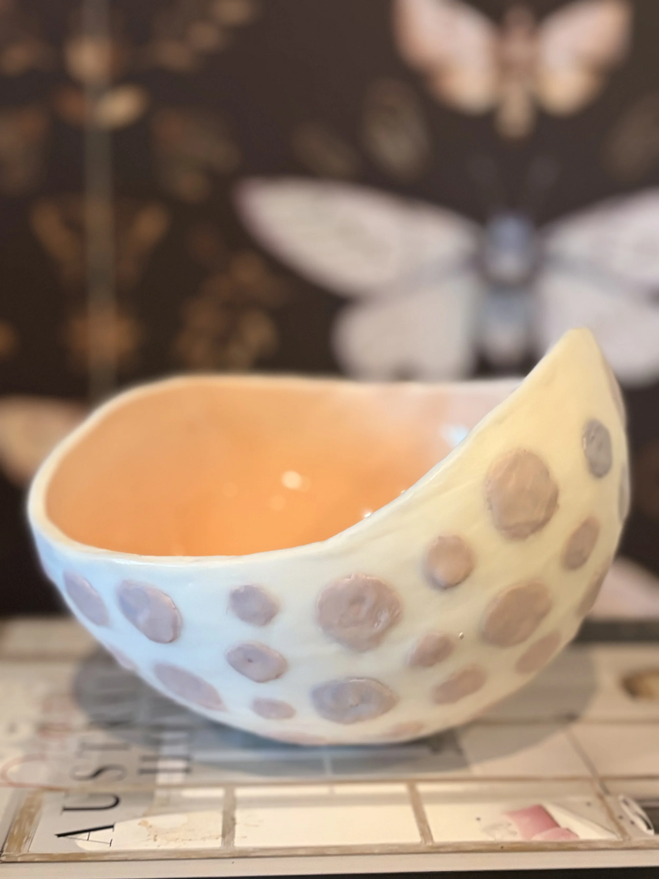 Original encaustic wax and resin vessel titled Musk Stick by Australian artist Karen Canning featuring soft blush pink raised dots on an ivory beeswax surface with a glossy pale pink resin interior.