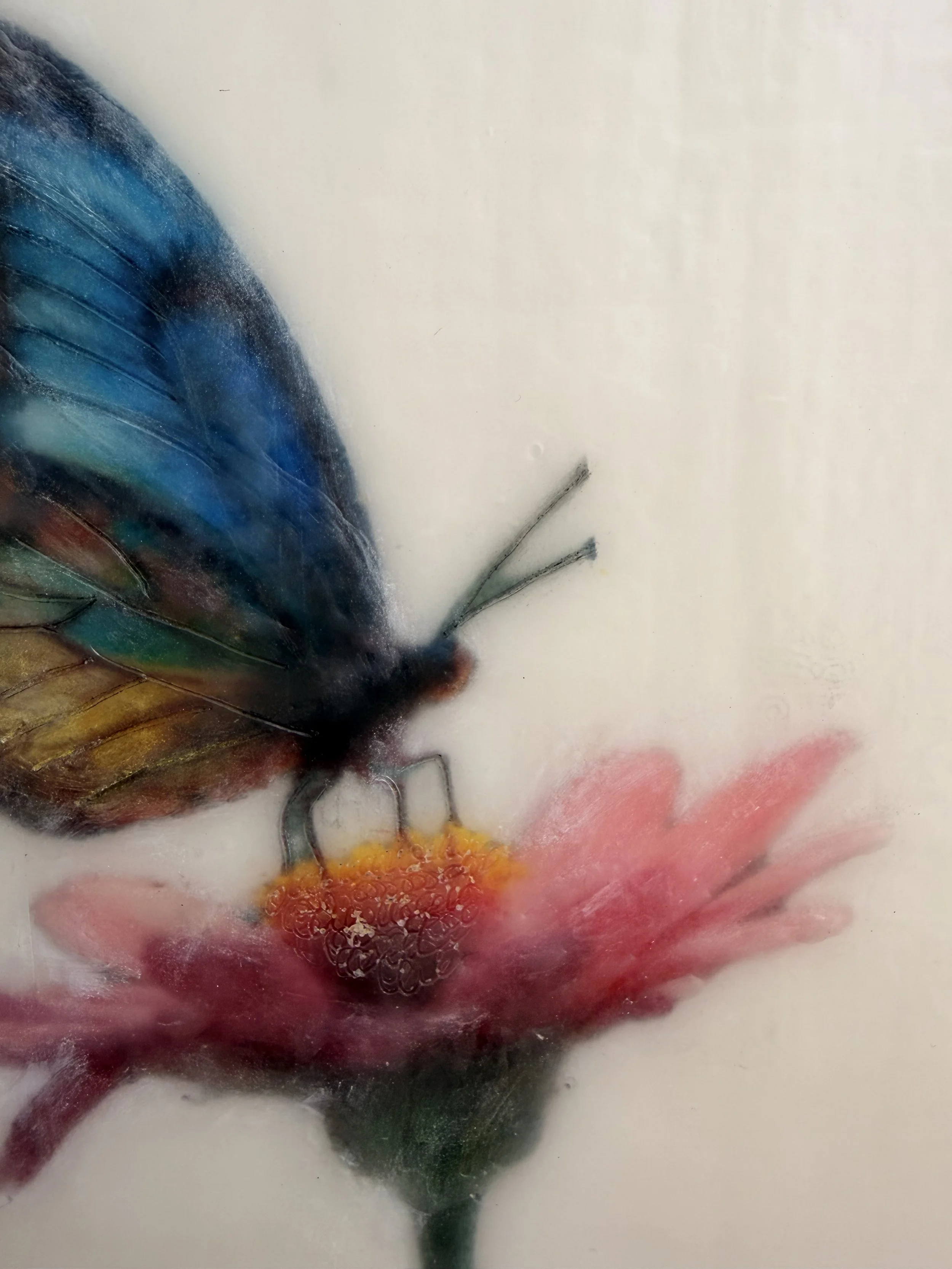 A blue and gold butterfly resting on a pink flower, rendered in luminous encaustic wax and mixed media with a dreamy, ethereal finish.