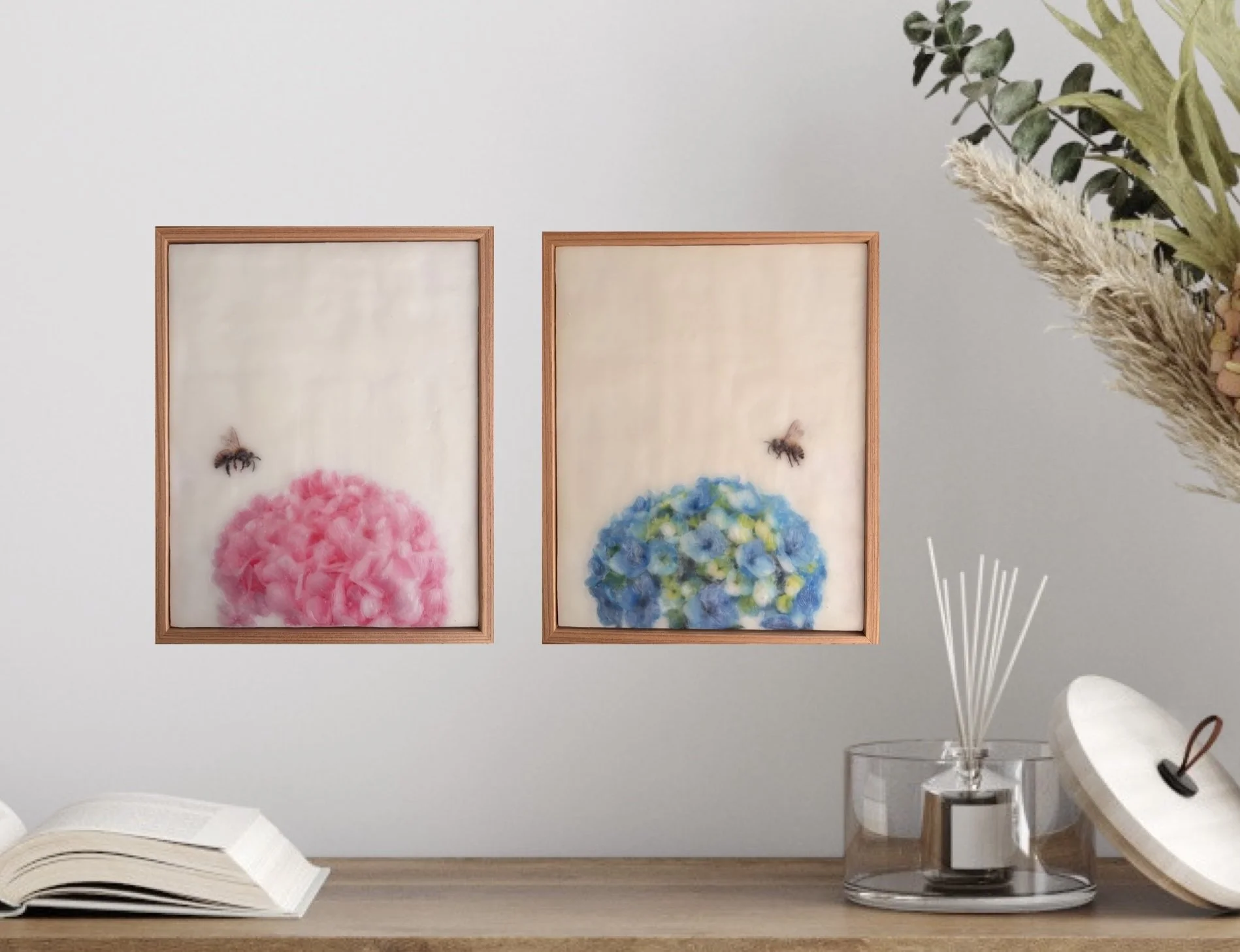 Original encaustic wax artwork featuring a honeybee hovering above blue hydrangea flowers, framed in Tasmanian oak with soft translucent beeswax layers.