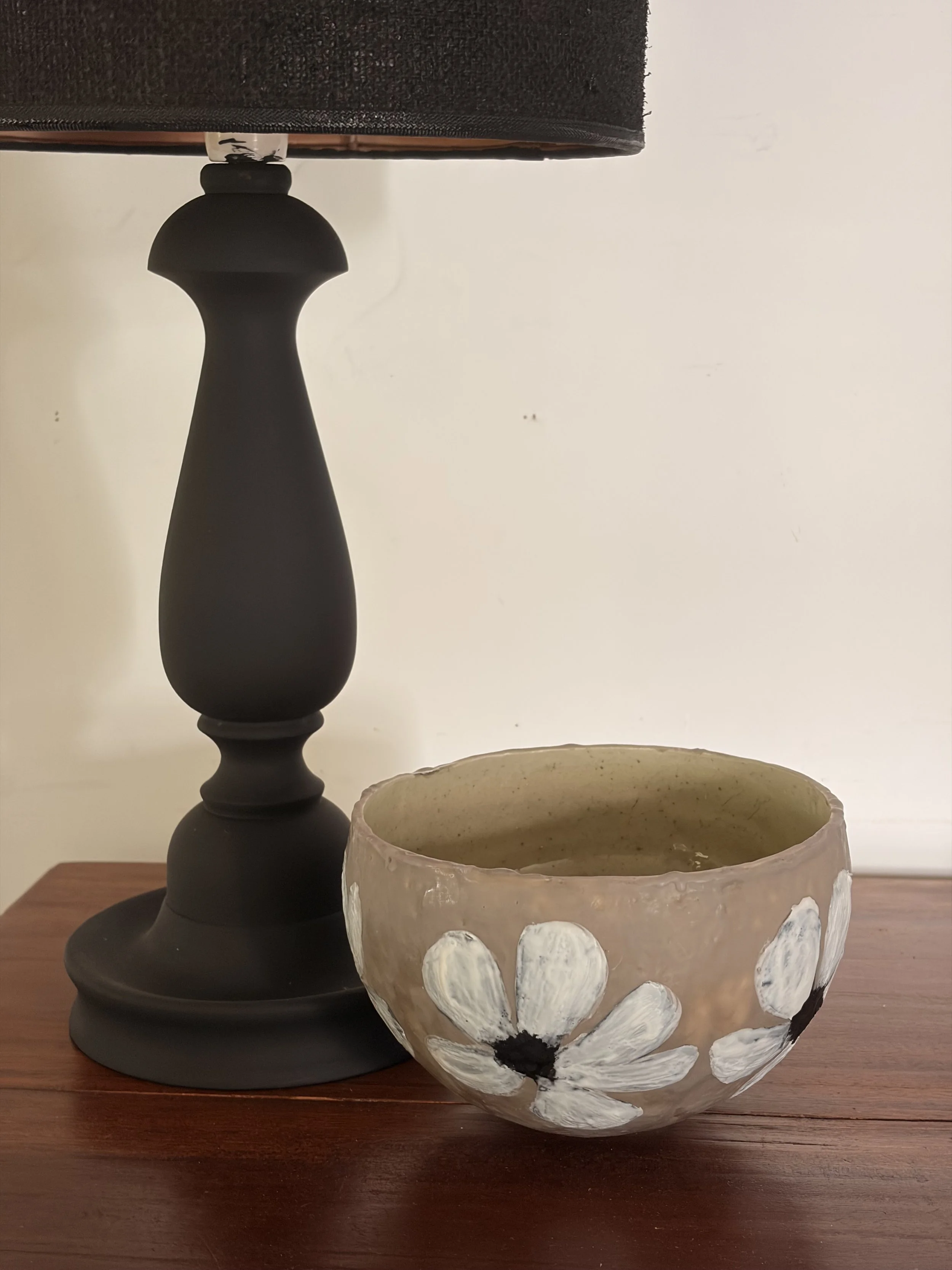 Small encaustic wax artwork titled “Hello Daisy” featuring a delicate daisy motif, layered beeswax texture, and a soft glossy resin interior, handmade by Australian artist Karen Canning.