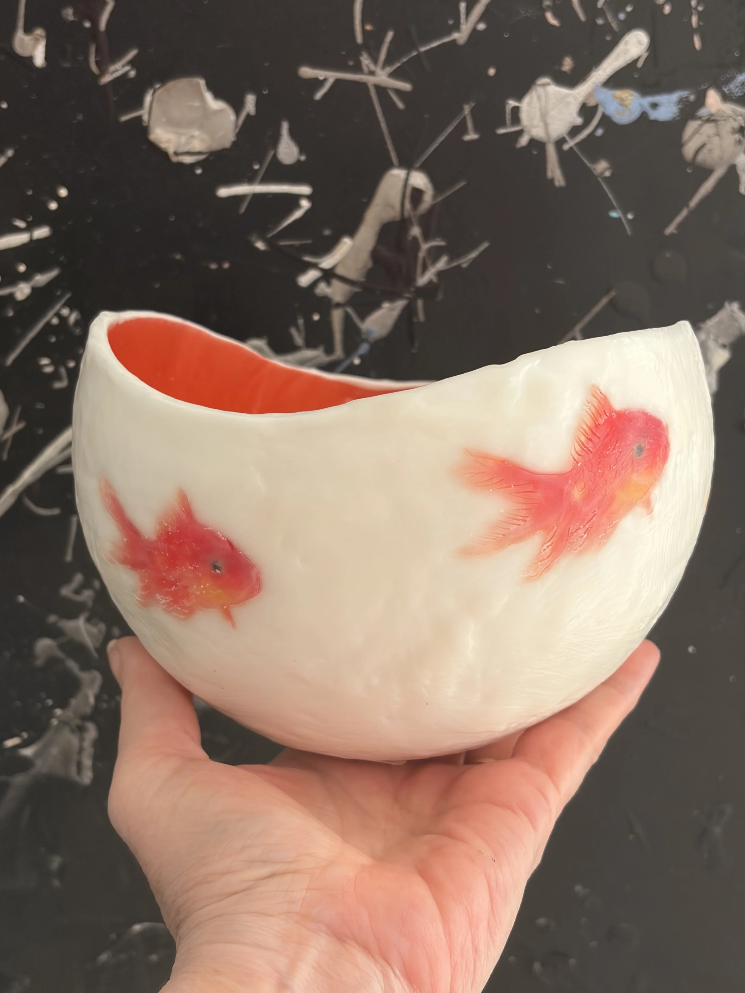 Handmade encaustic wax vessel with luminous  white exterior and goldfish design, featuring soft translucent layers and a warm orange interior, 17 x 13 cm sculptural art bowl.