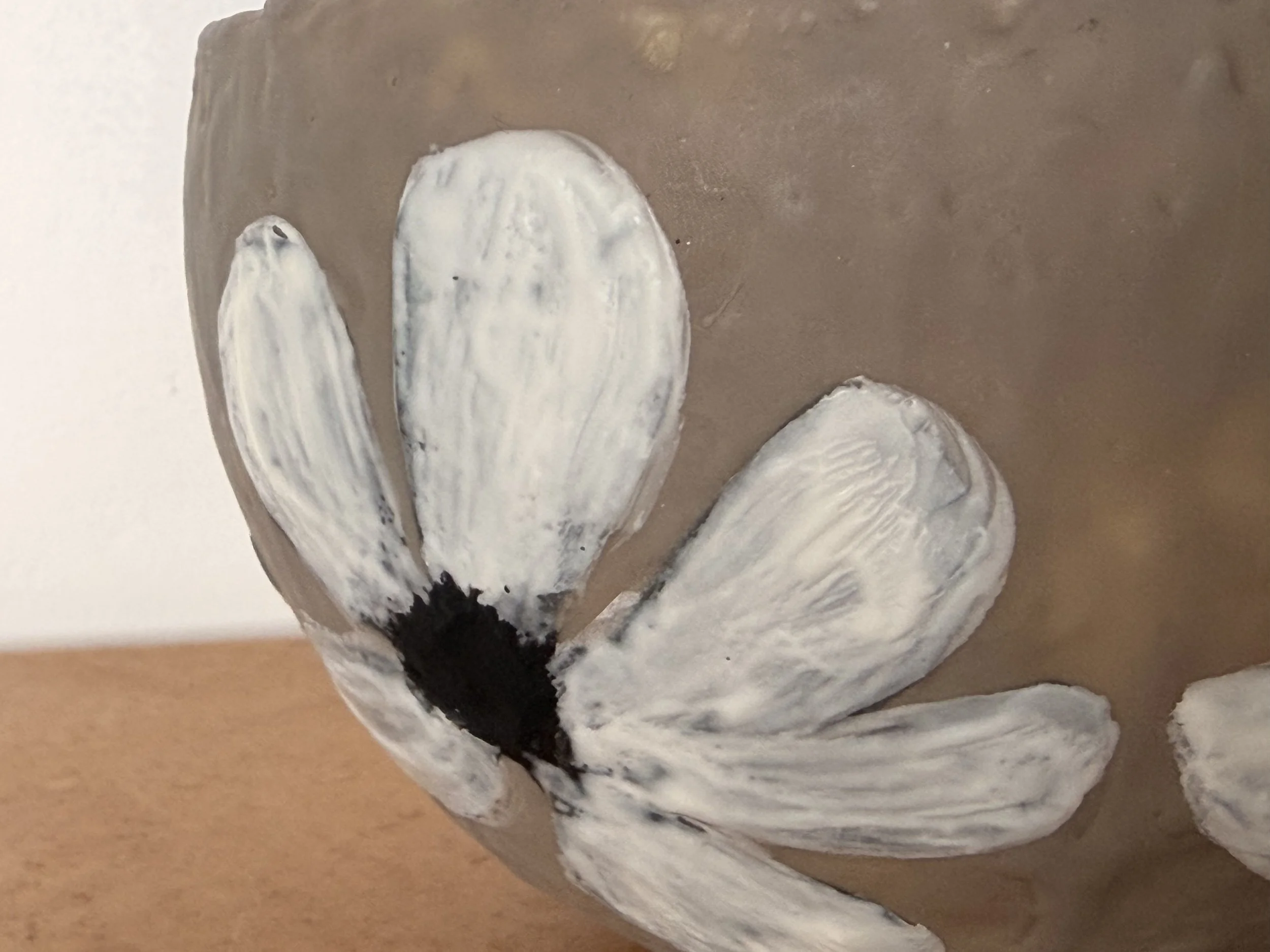 Small encaustic wax artwork titled “Hello Daisy” featuring a delicate daisy motif, layered beeswax texture, and a soft glossy resin interior, handmade by Australian artist Karen Canning.