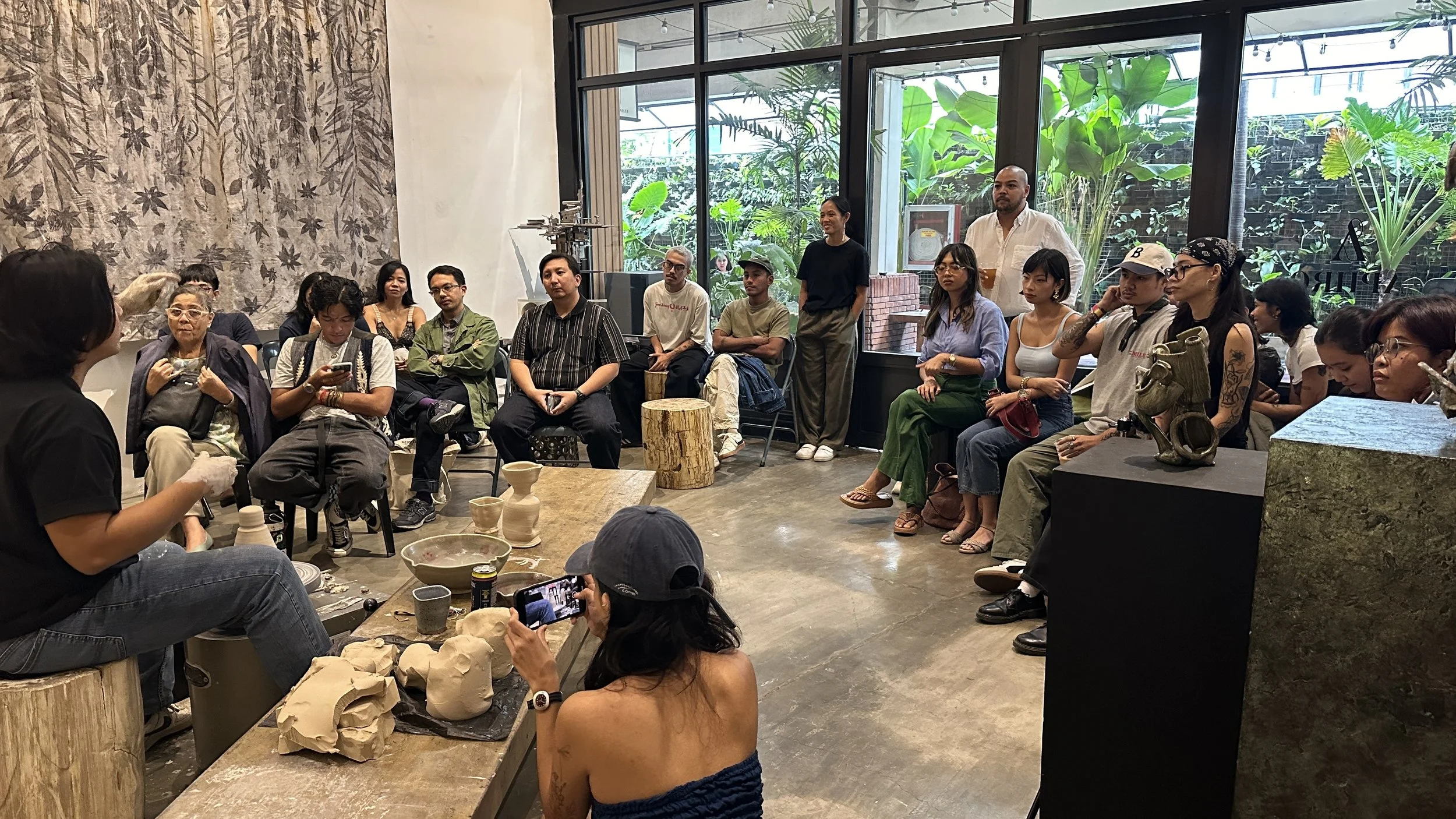 Filipino ceramic artist Jose Solon Perfecto performs a live demo on the pottery wheel during his artist talk at Aphro in Makati City