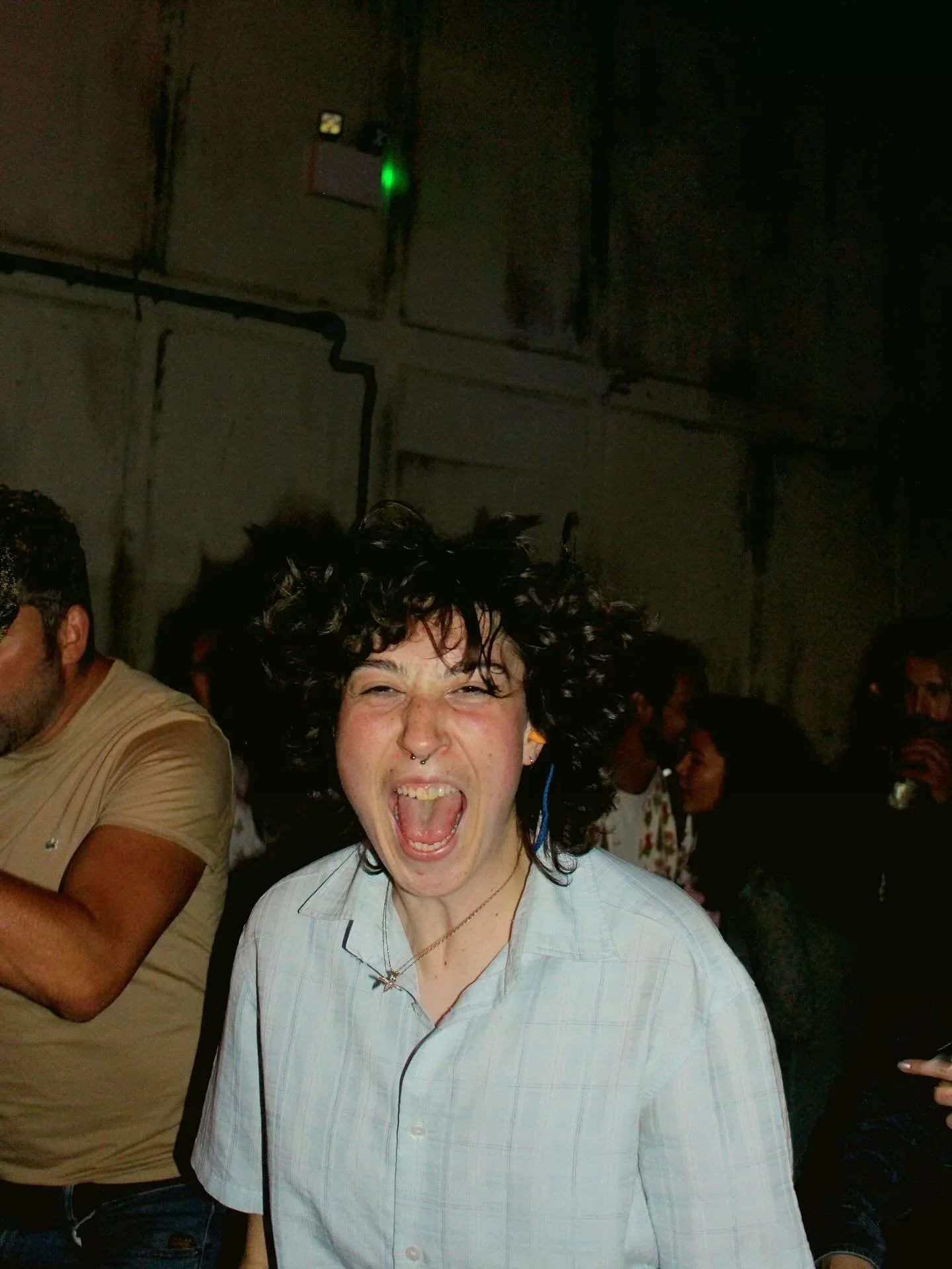 Guest smiling on the dancefloor during a club night at Oculist Brighton.