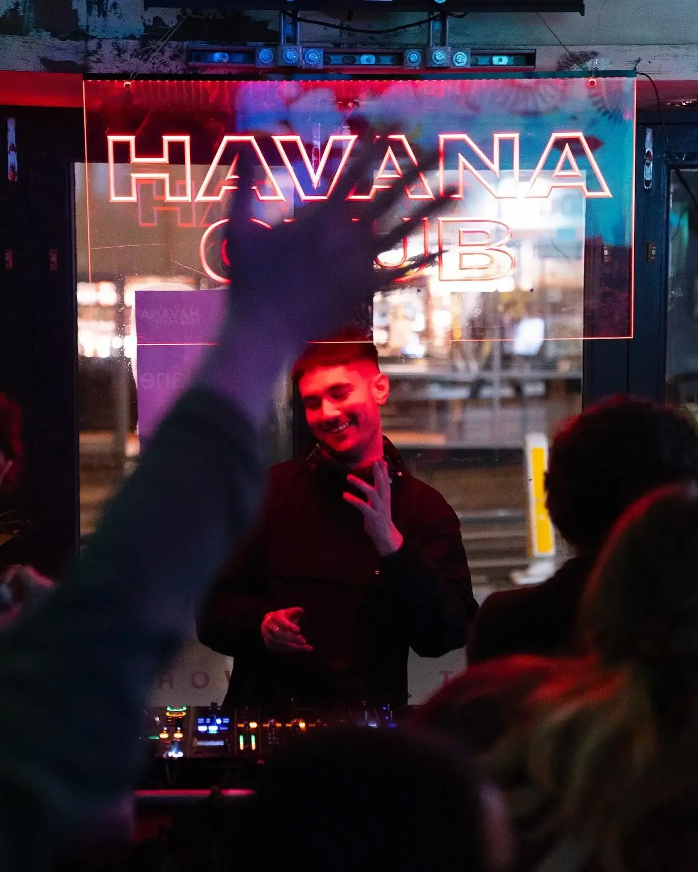 DJ playing to a crowd at a club night inside Oculist Brighton.