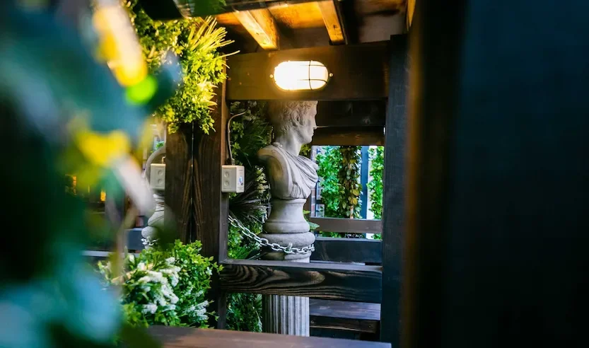 Greenery and seating area on the roof terrace at Oculist Brighton