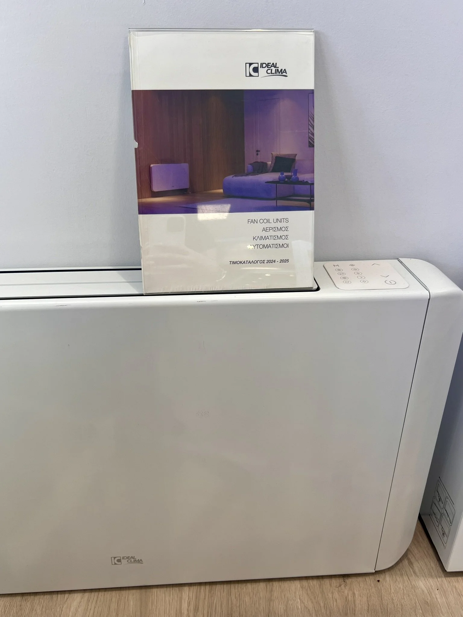 Tsolakidis store display featuring fan coil unit.
