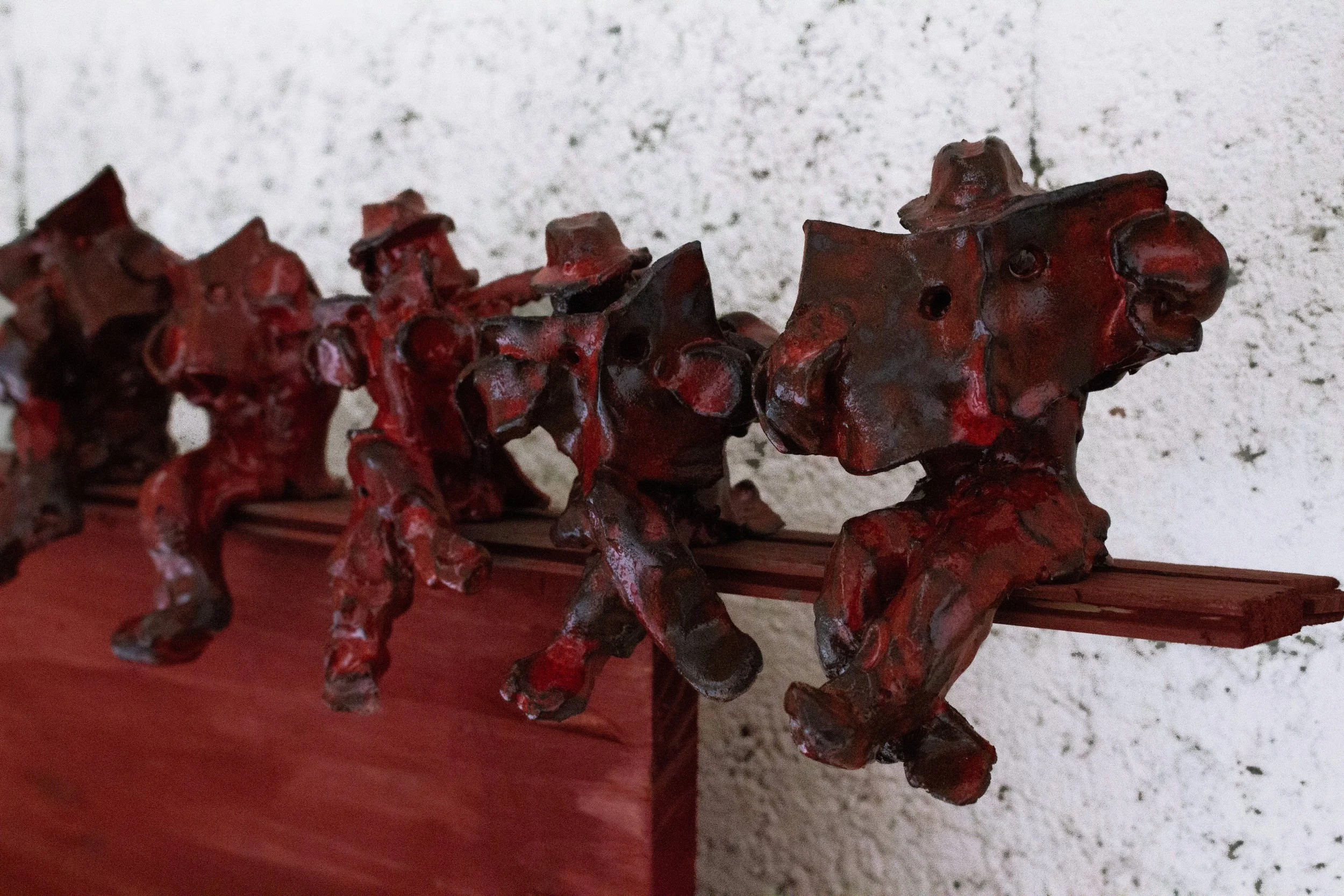 Detail of "Voyeurs" - glazed ceramic, wood, acrylic, wax, 2025                                              